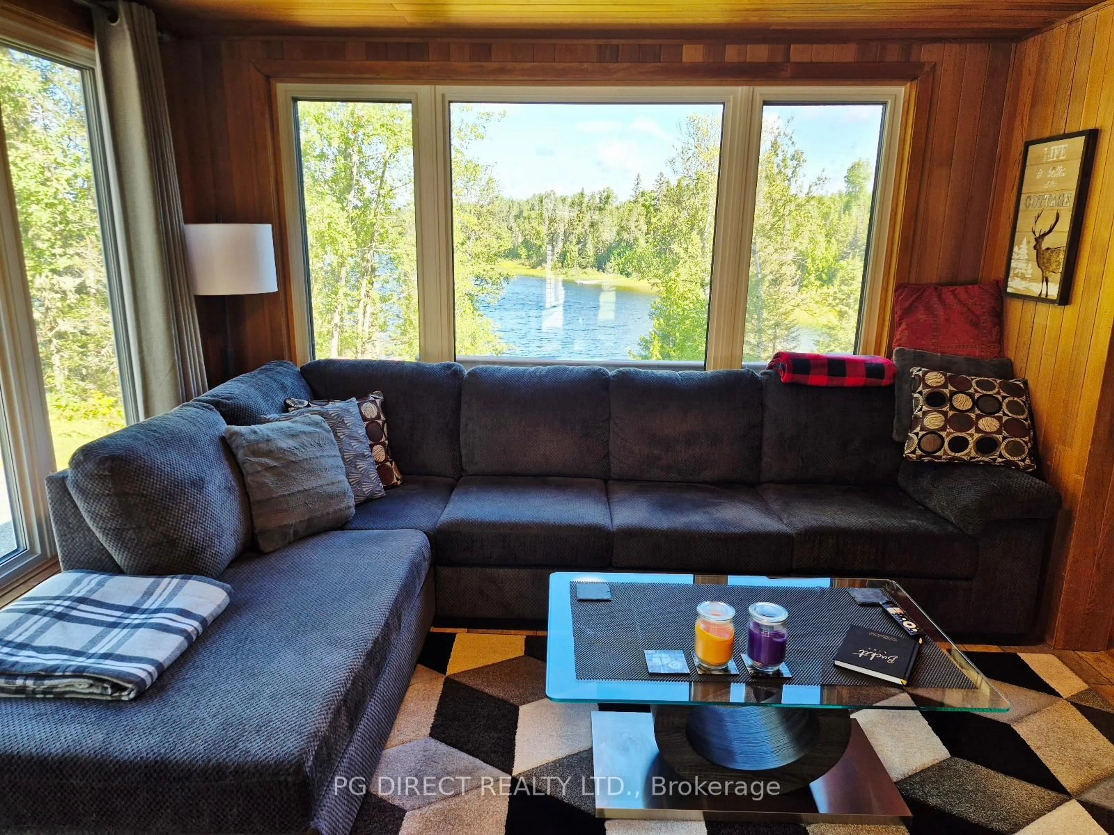 Living room with furniture, wood/laminate floor for 35 Birchill Rd, Cochrane Ontario P0L 1C0