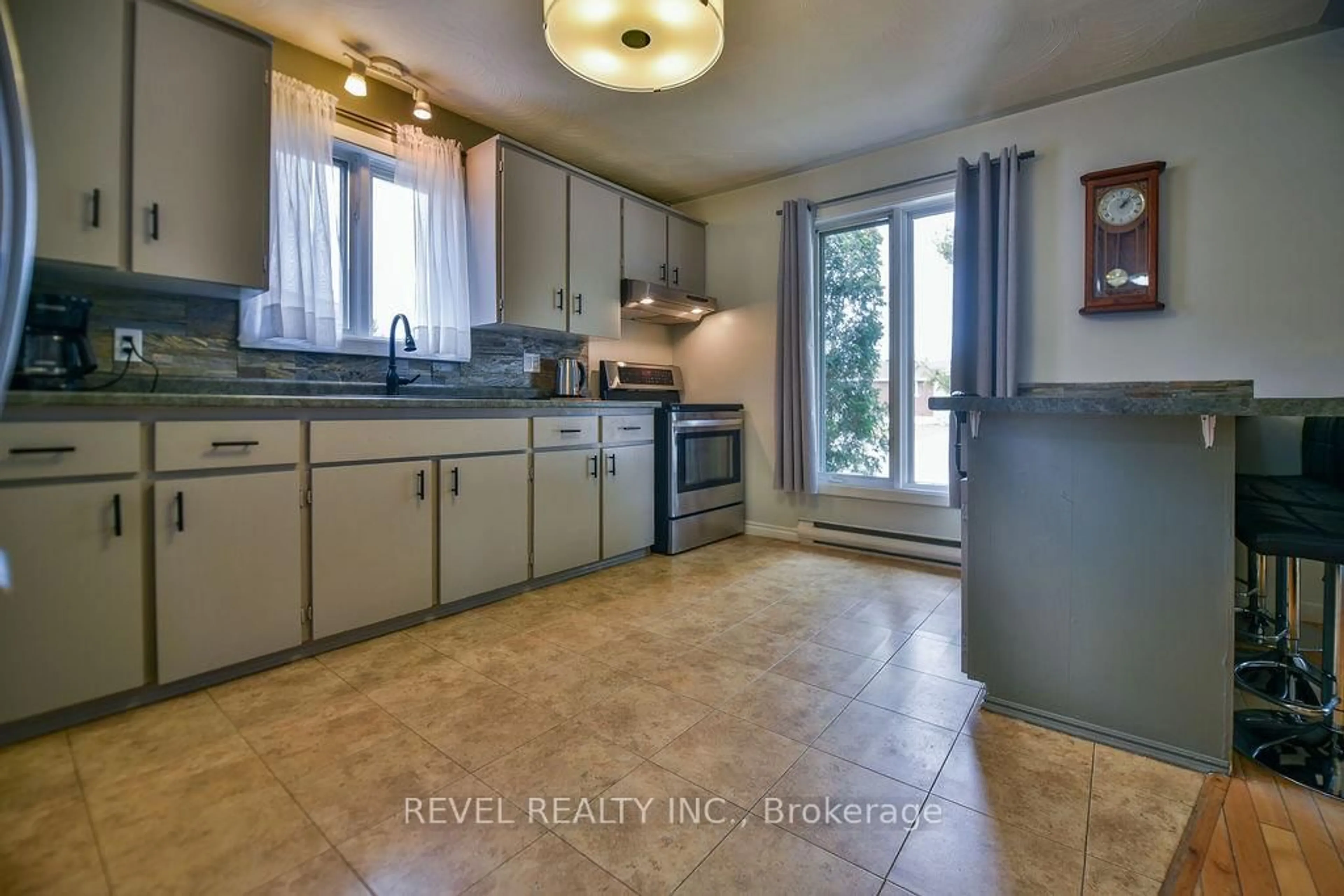 Open concept kitchen, ceramic/tile floor for 100 Brock Ave, Timmins Ontario P4N 7P1
