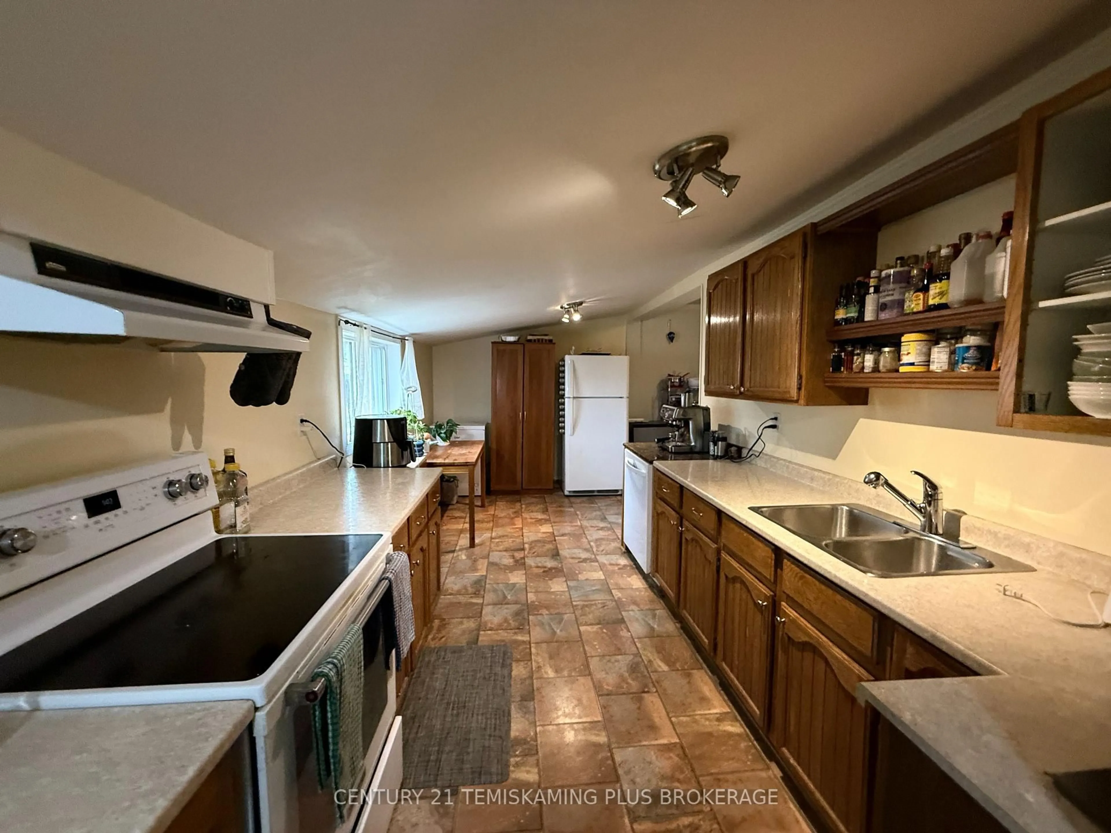 Kitchen with laundary machines, ceramic/tile floor for 81 First St, Kirkland Lake Ontario P2N 1N4