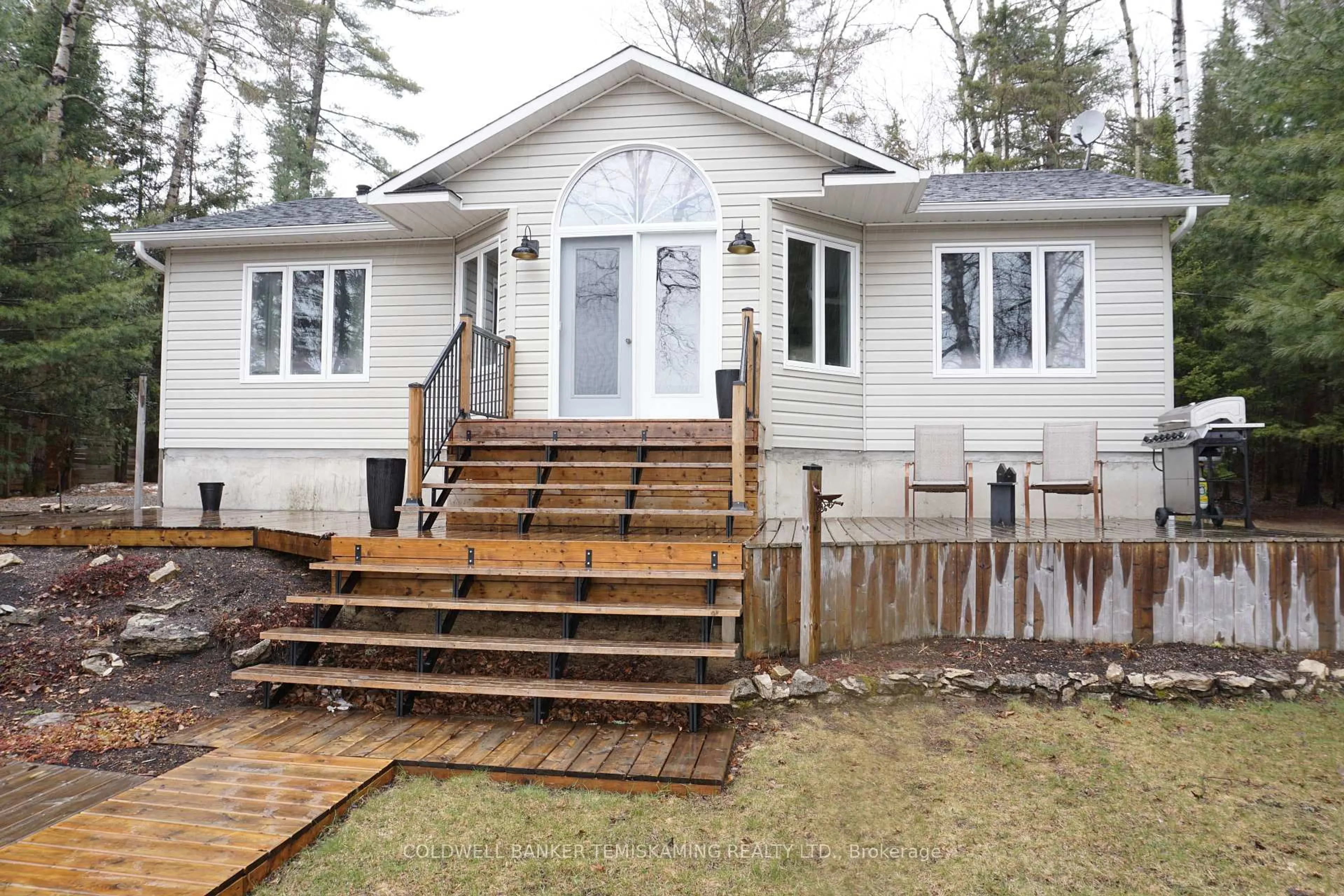 Home with vinyl exterior material, street for 7118 Twin Lakes Rd, Timiskaming Ontario P0J 1P0