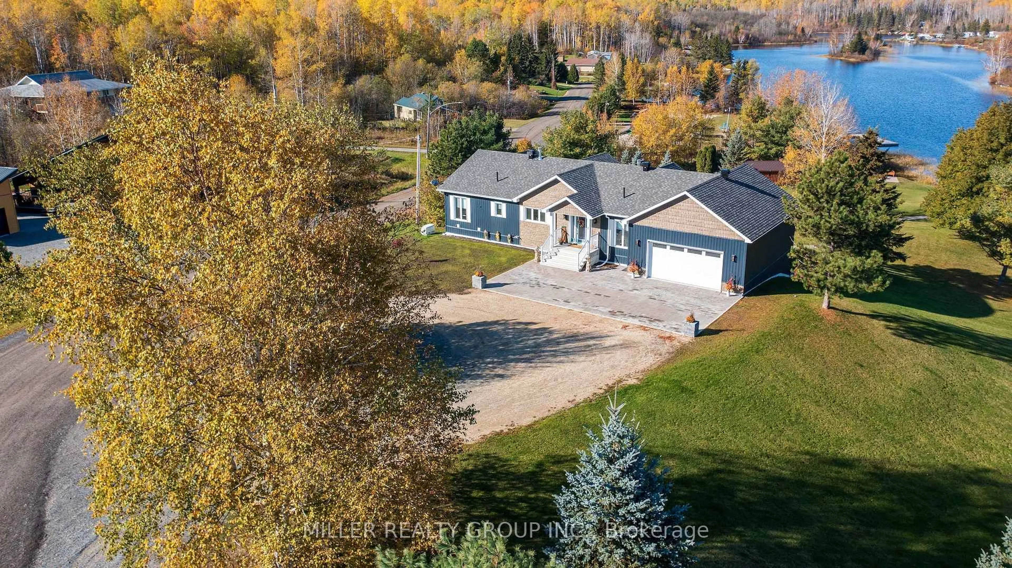 A pic from outside/outdoor area/front of a property/back of a property/a pic from drone, water/lake/river/ocean view for 2 Lakeshore Ave, Englehart Ontario P0J 1B0