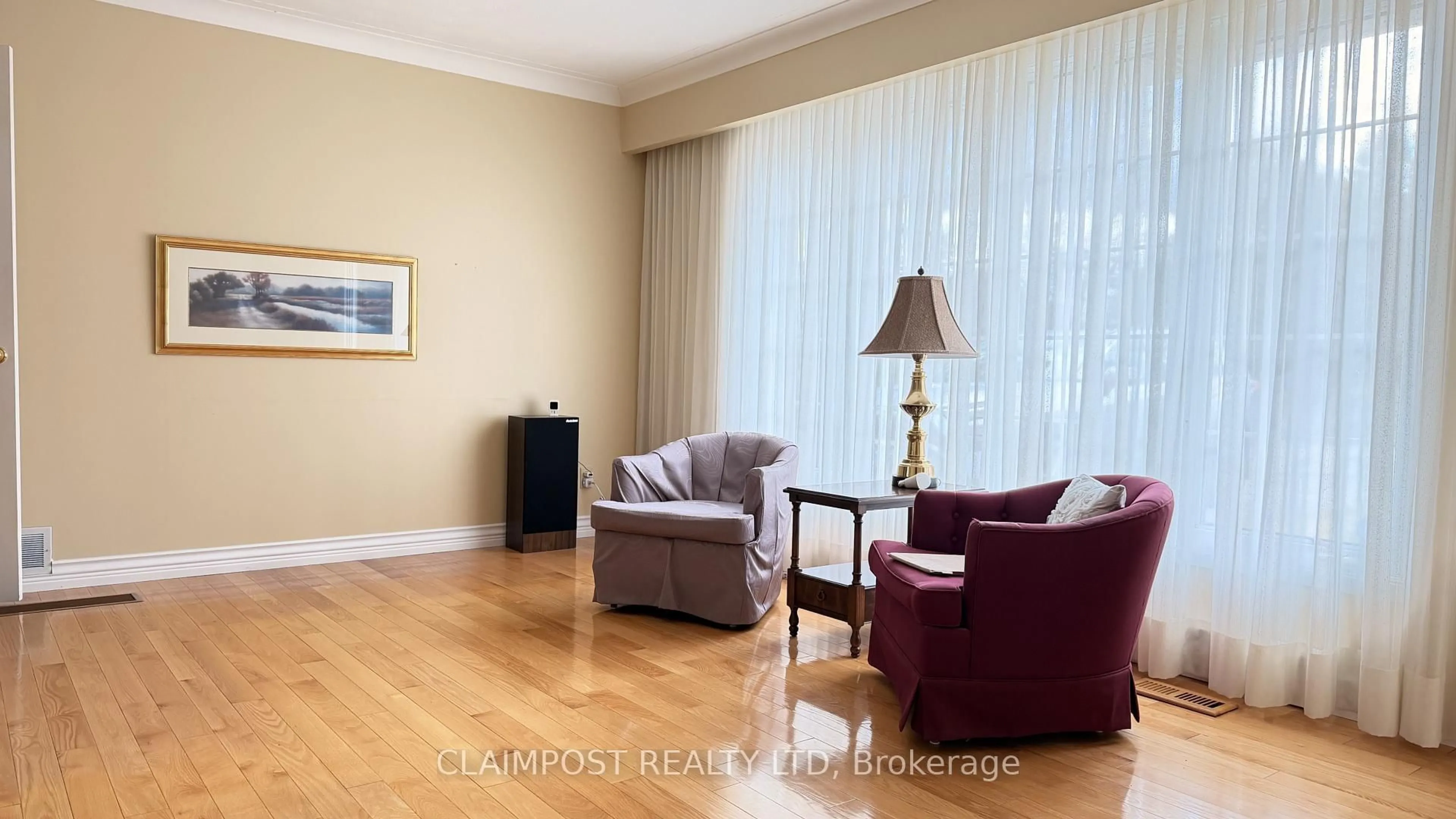 Living room with furniture, wood/laminate floor for 670 Spruce St, Timmins Ontario P4N 6P3