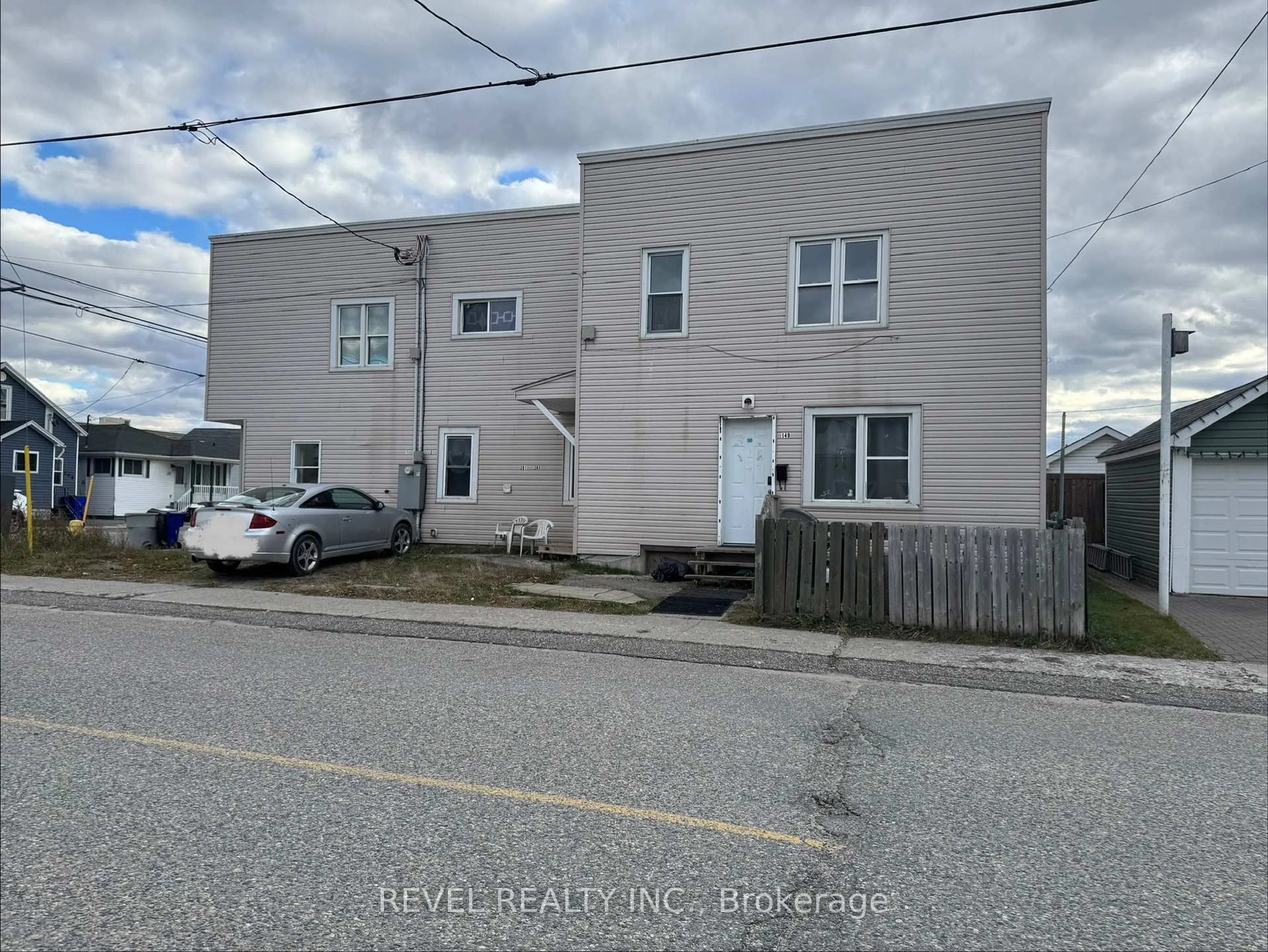 A pic from outside/outdoor area/front of a property/back of a property/a pic from drone, street for 201-203 Balsam St, Timmins Ontario P4N 2E3