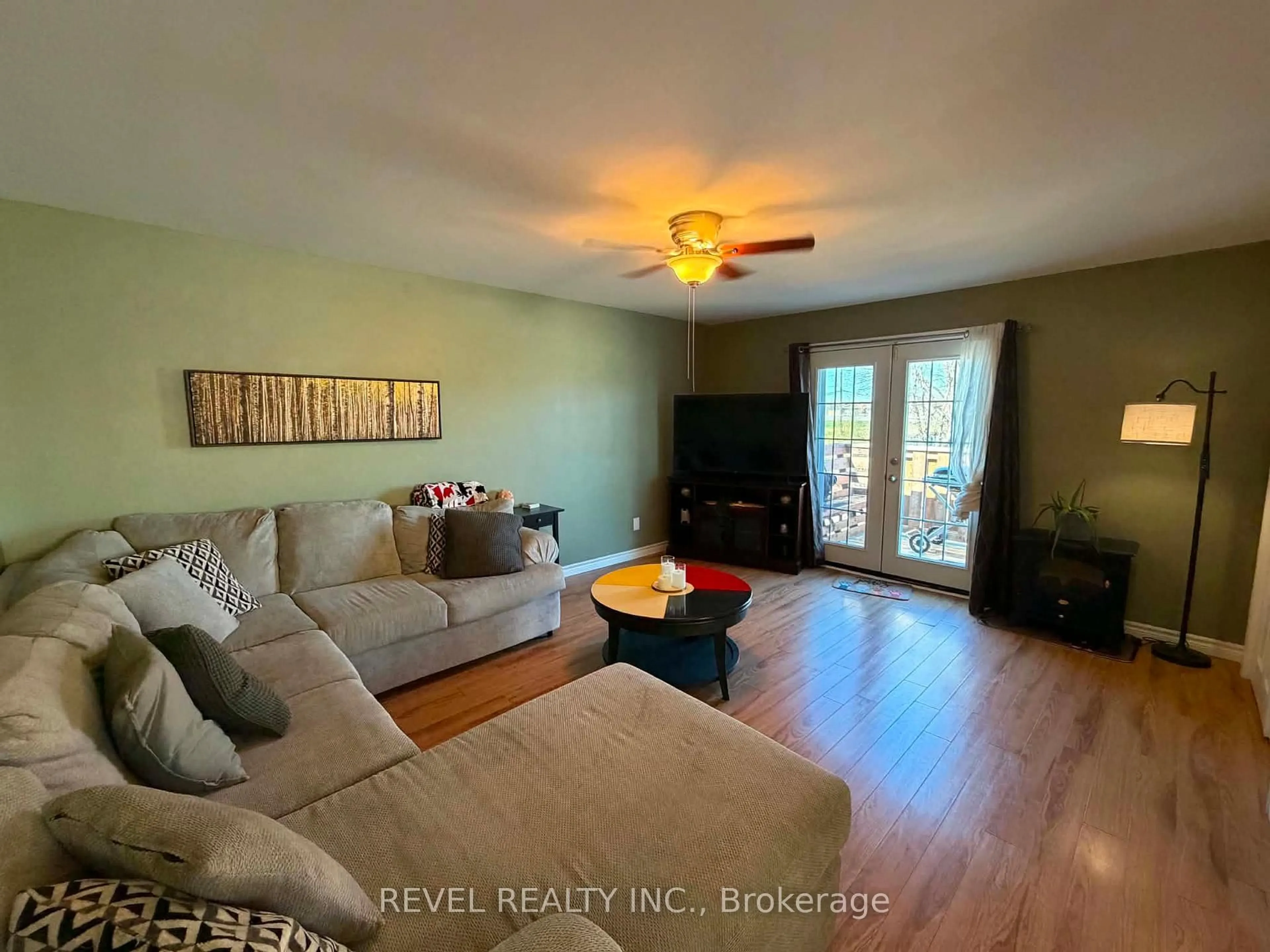 Living room with furniture, wood/laminate floor for 894 Suzanne St, Timmins Ontario P4P 1A9