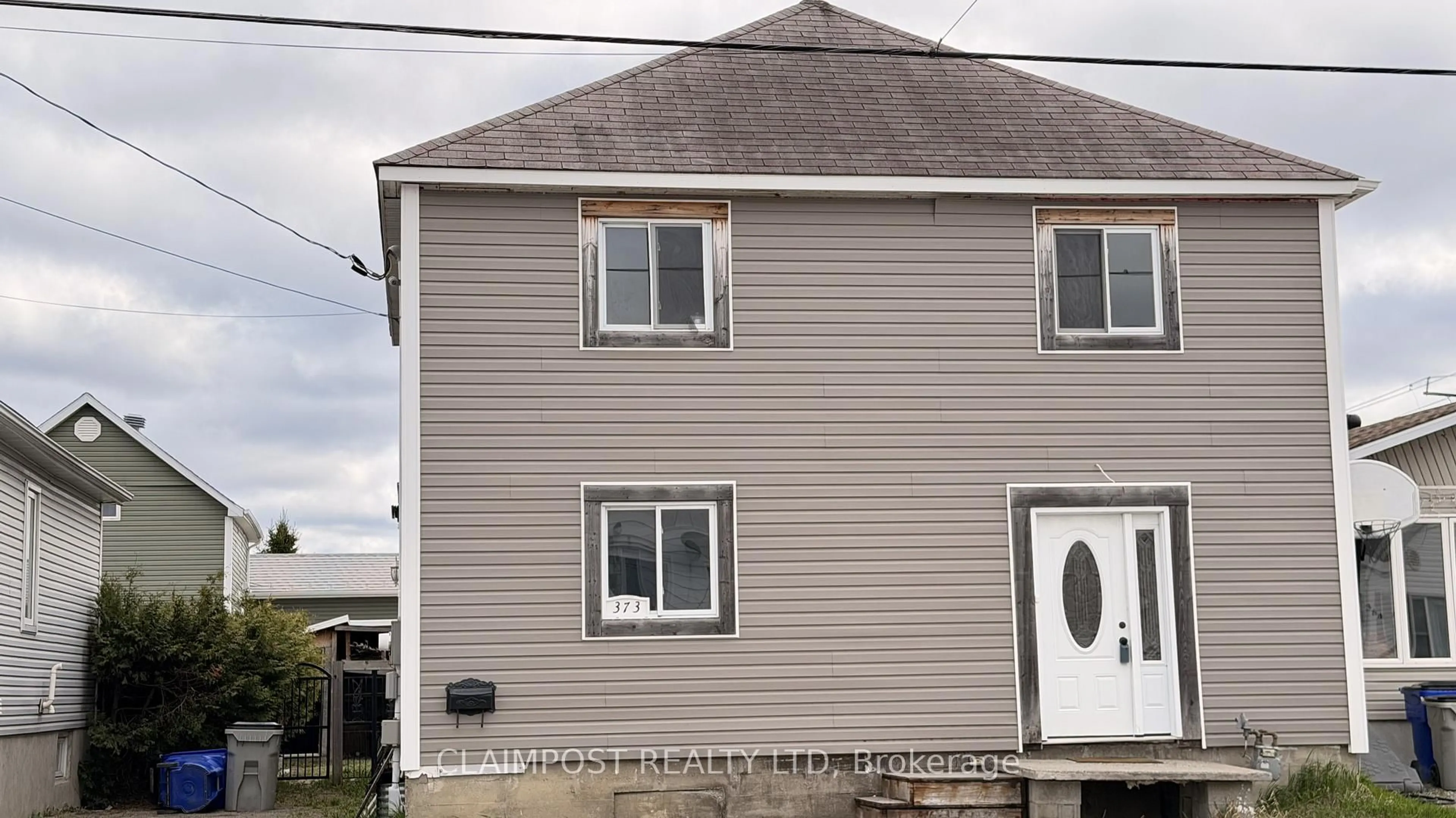 Home with vinyl exterior material, building for 373 Commercial Ave, Timmins Ontario P4N 2X8