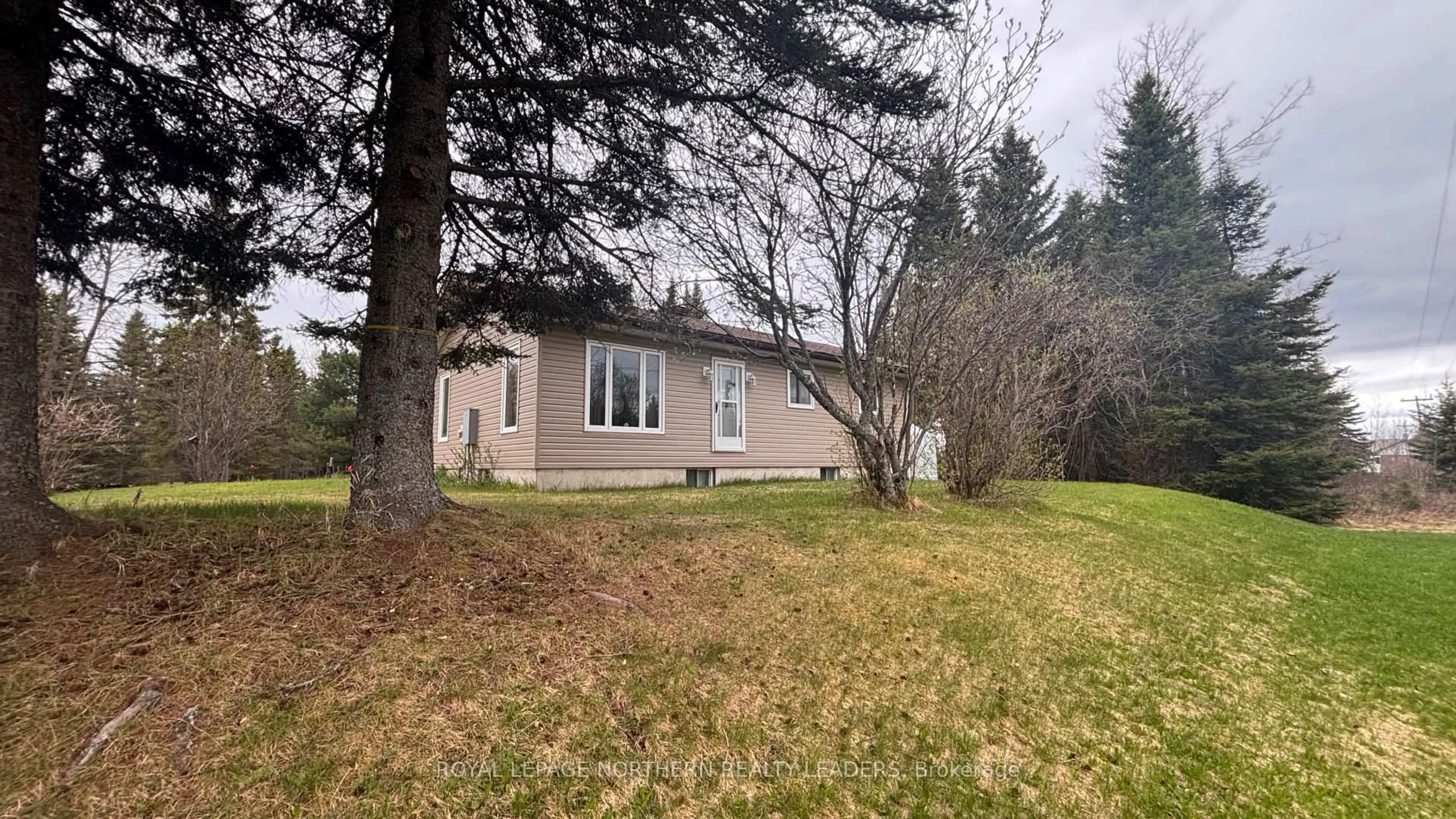 A pic from outside/outdoor area/front of a property/back of a property/a pic from drone, street for 9255 Hwy 11 Highway, Iroquois Falls Ontario P0K 1G0