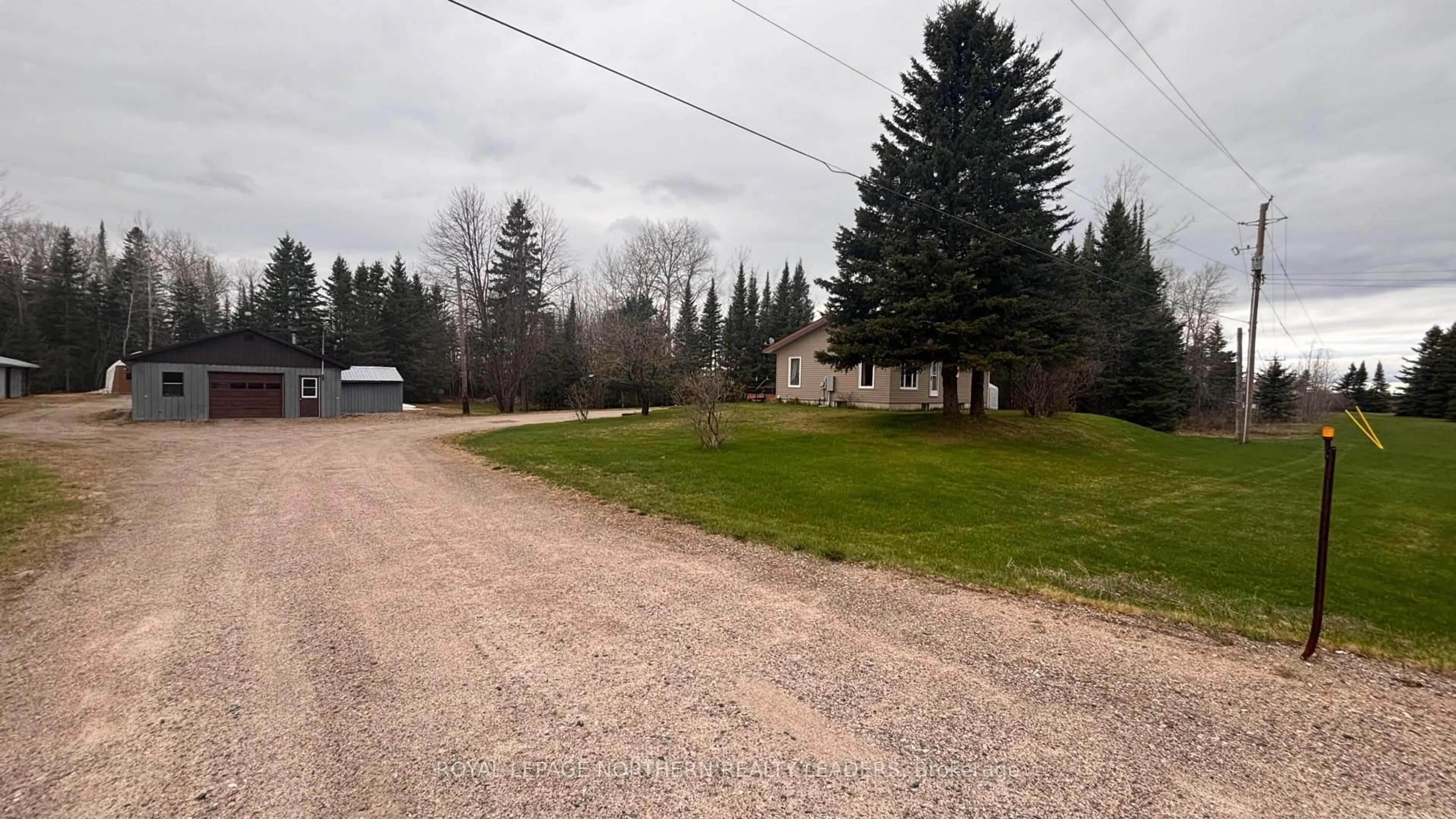 A pic from outside/outdoor area/front of a property/back of a property/a pic from drone, street for 9255 Hwy 11 Highway, Iroquois Falls Ontario P0K 1G0