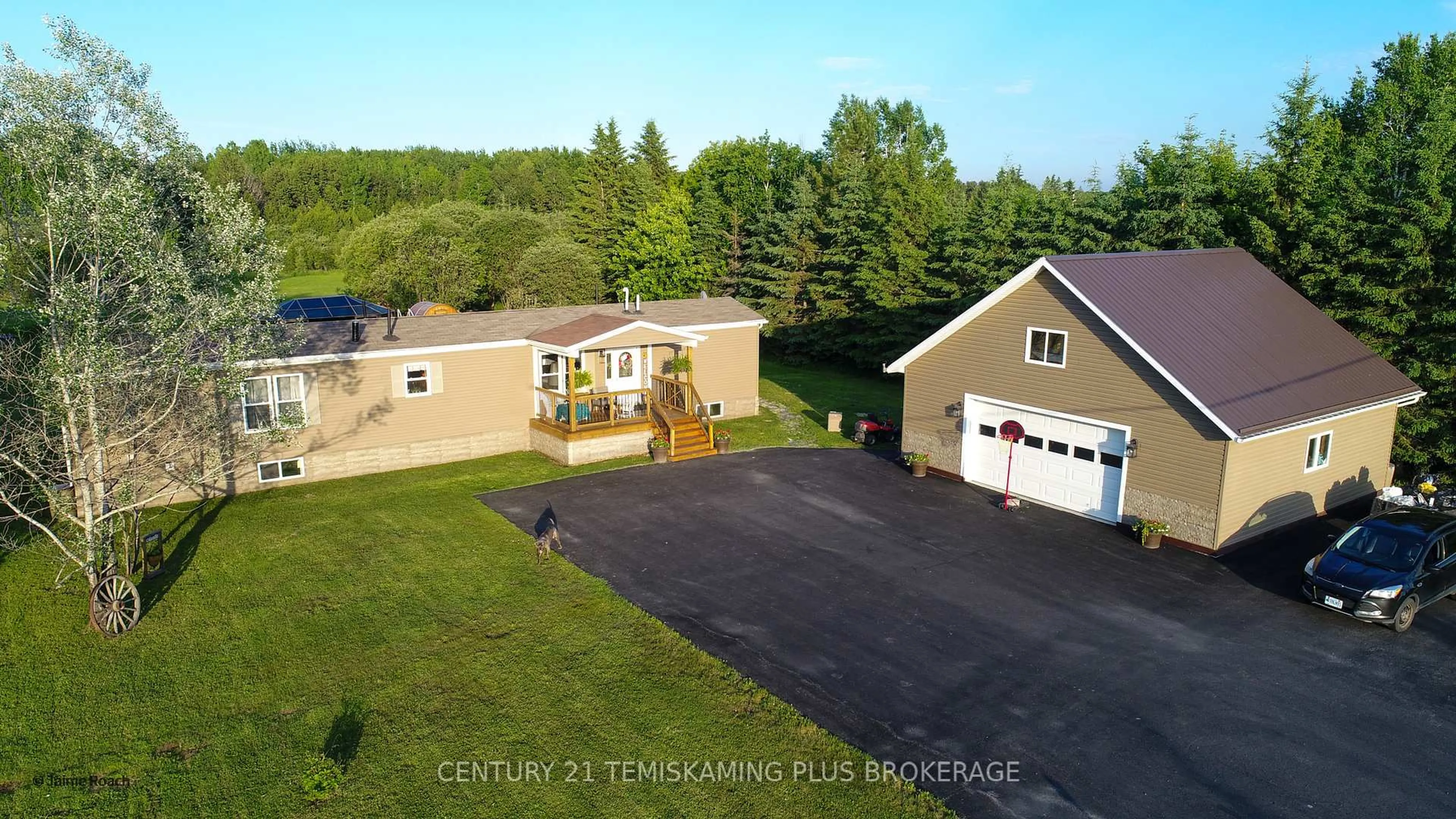 A pic from outside/outdoor area/front of a property/back of a property/a pic from drone, building for 474203 Kap Kig Iwan Rd, Englehart Ontario P0J 1H0