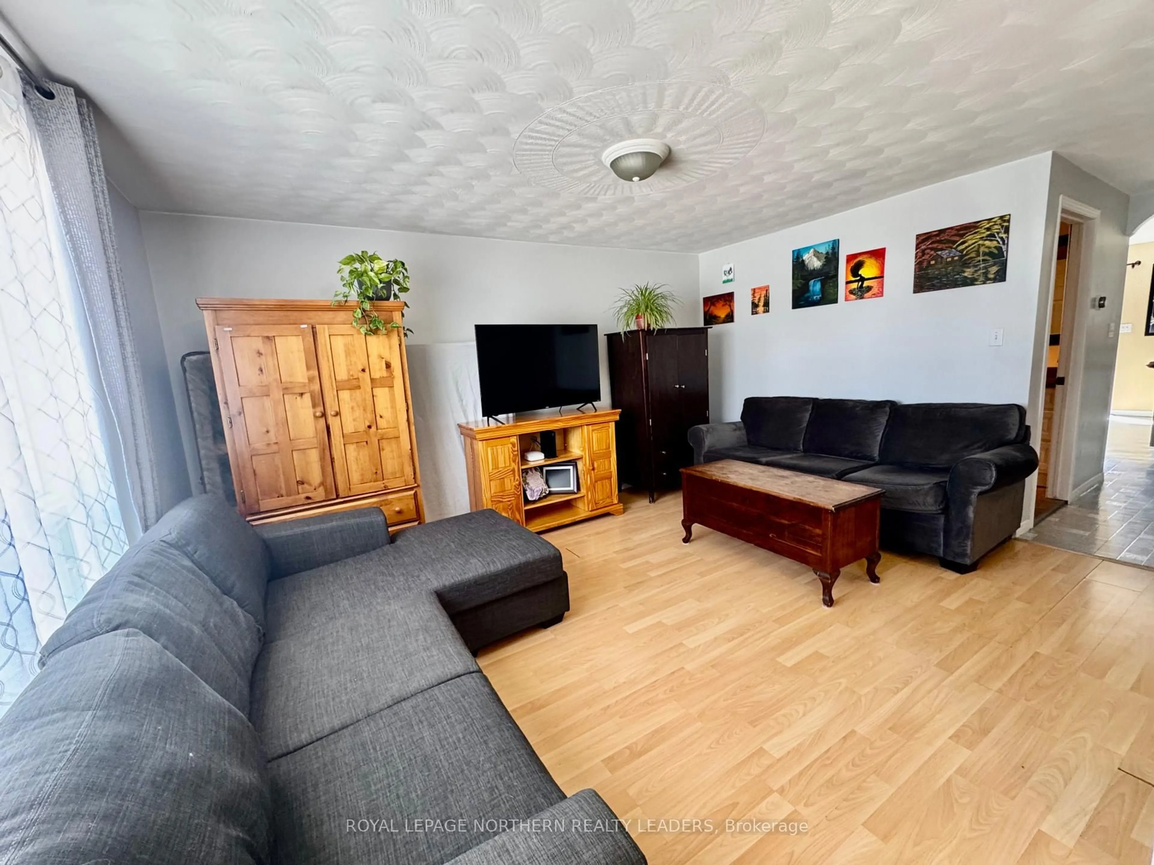 Living room with furniture, unknown for 7 Borden Ave, Timmins Ontario P4N 4E6