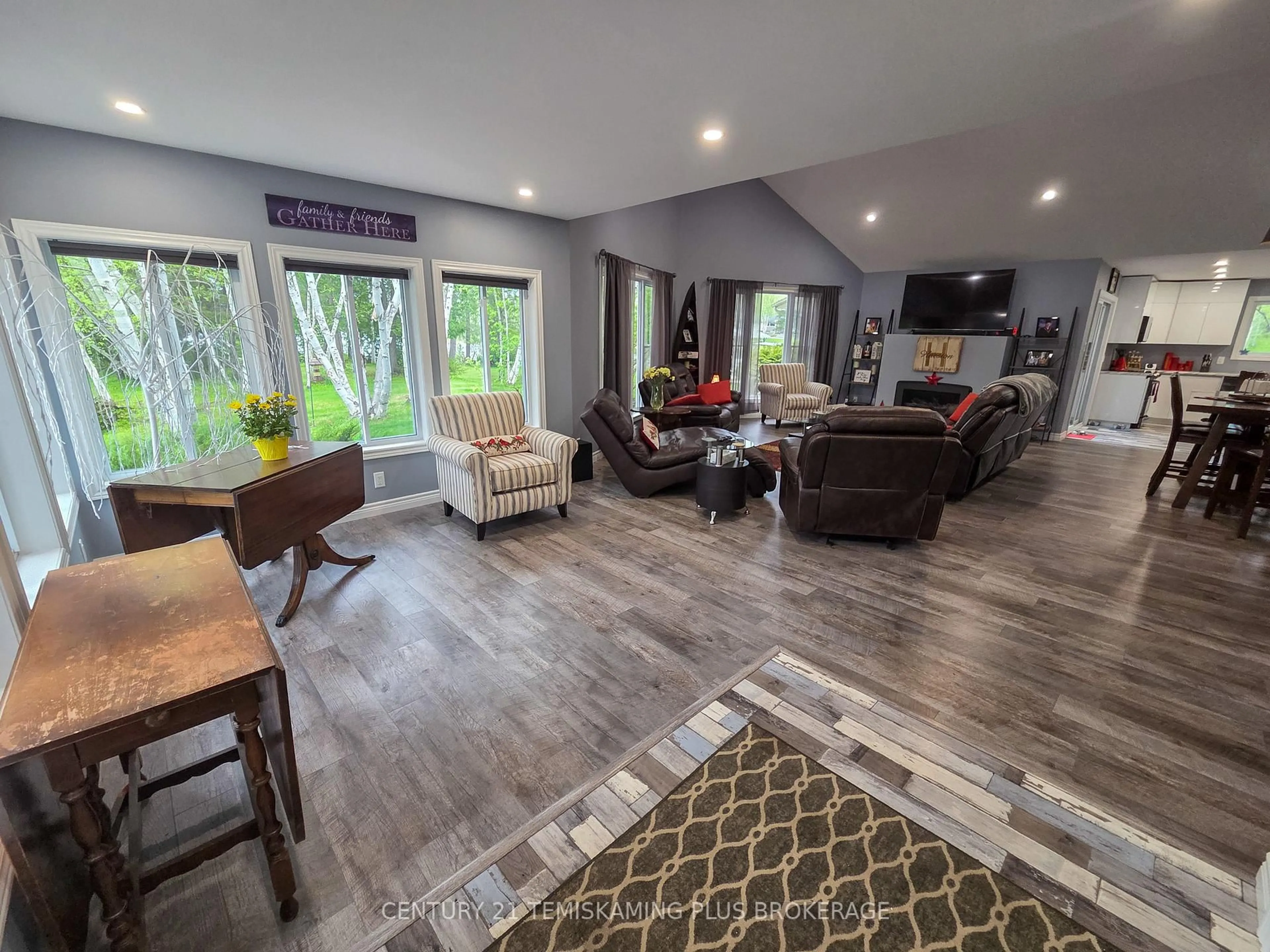 Living room with furniture, wood/laminate floor for 794022 Island Rd, Englehart Ontario P0J 1B0