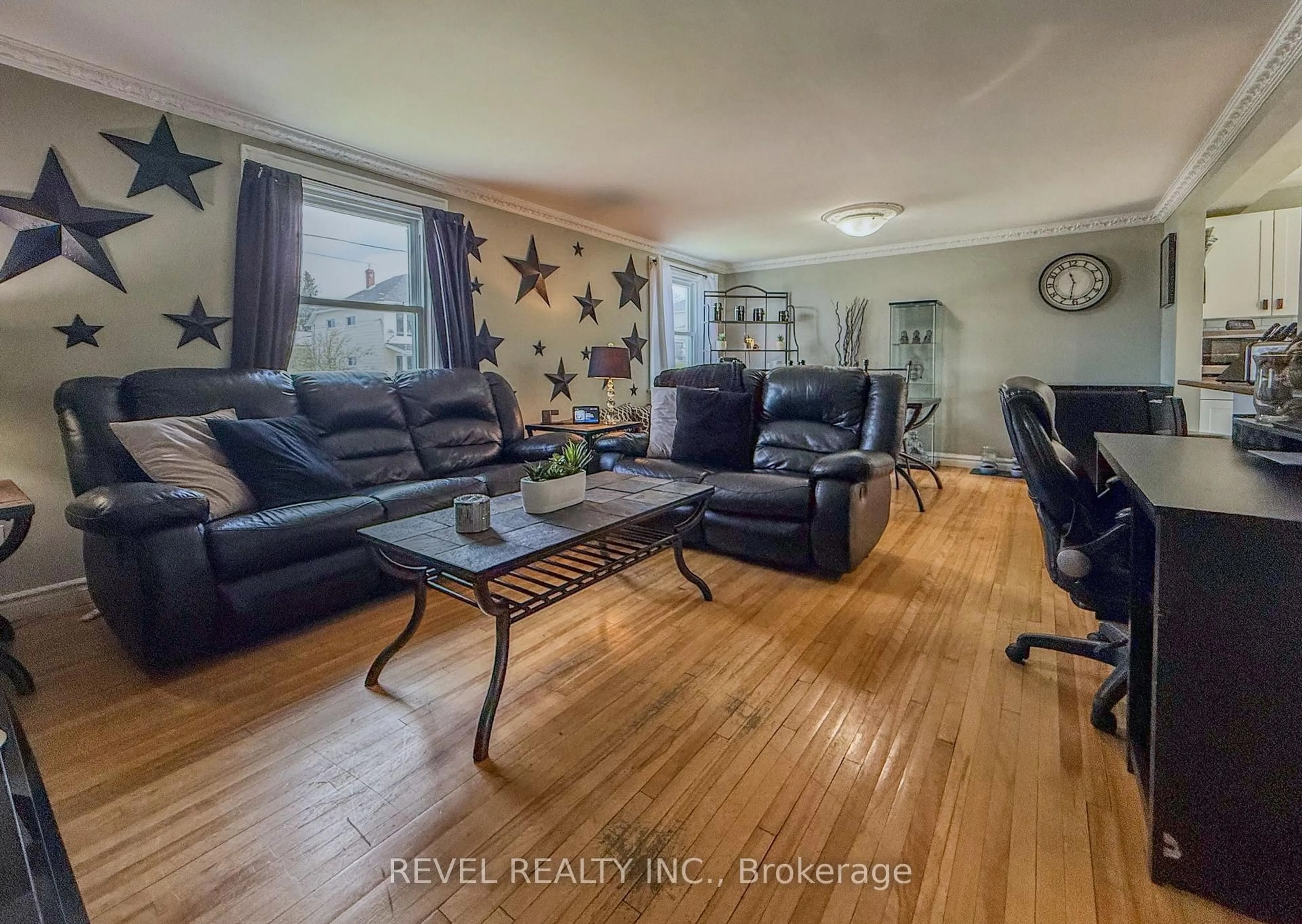 Living room with furniture, wood/laminate floor for 391 - 399 Murdock Ave, Timmins Ontario P4N 5T9