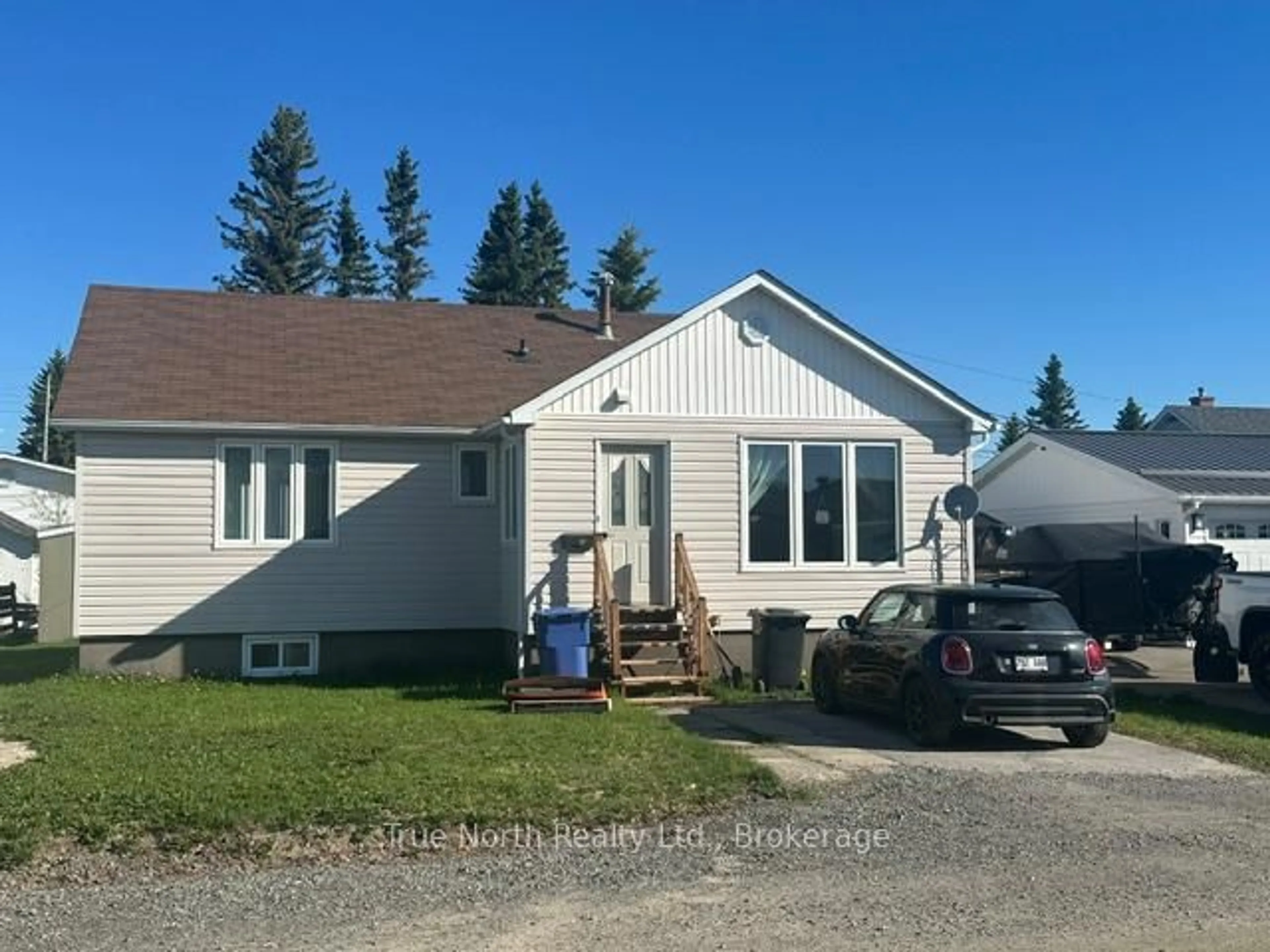 Home with vinyl exterior material, street for 34 Birch St, Kapuskasing Ontario P5N 1Z9