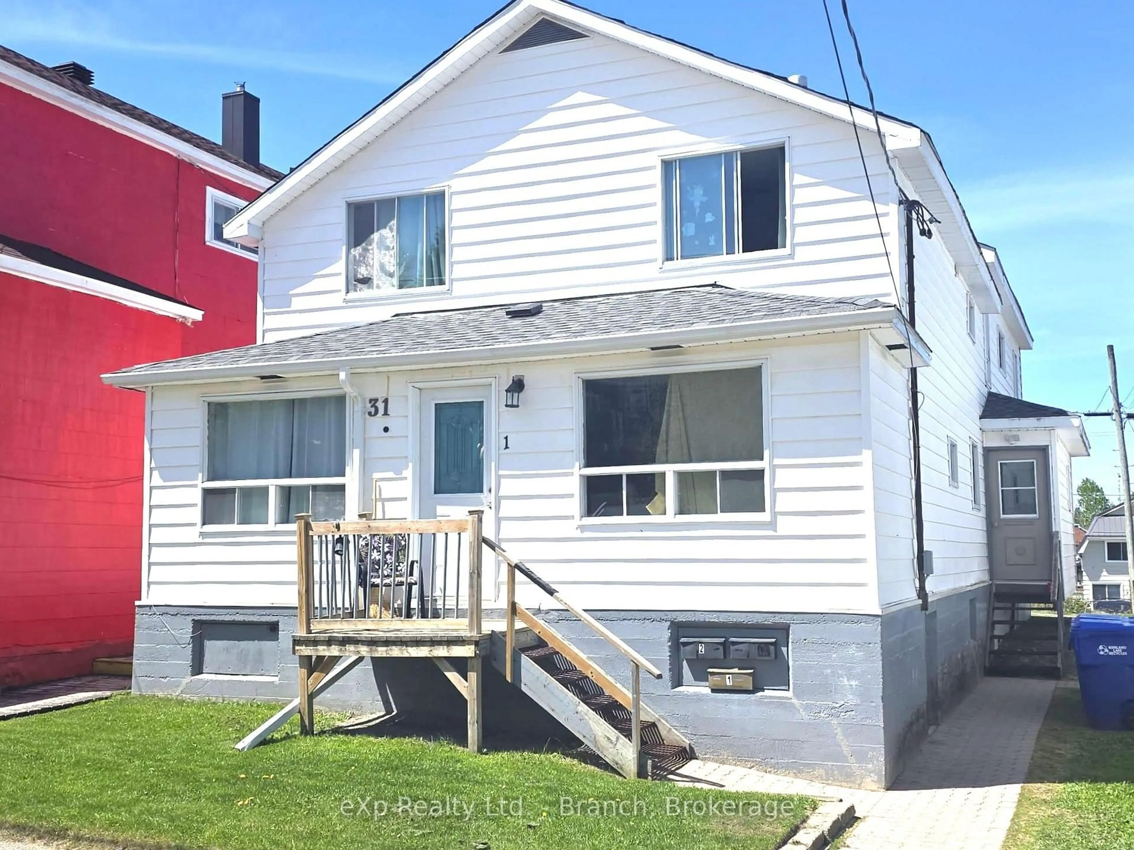 Home with vinyl exterior material, street for 31 Woods St, Kirkland Lake Ontario P2N 3B7
