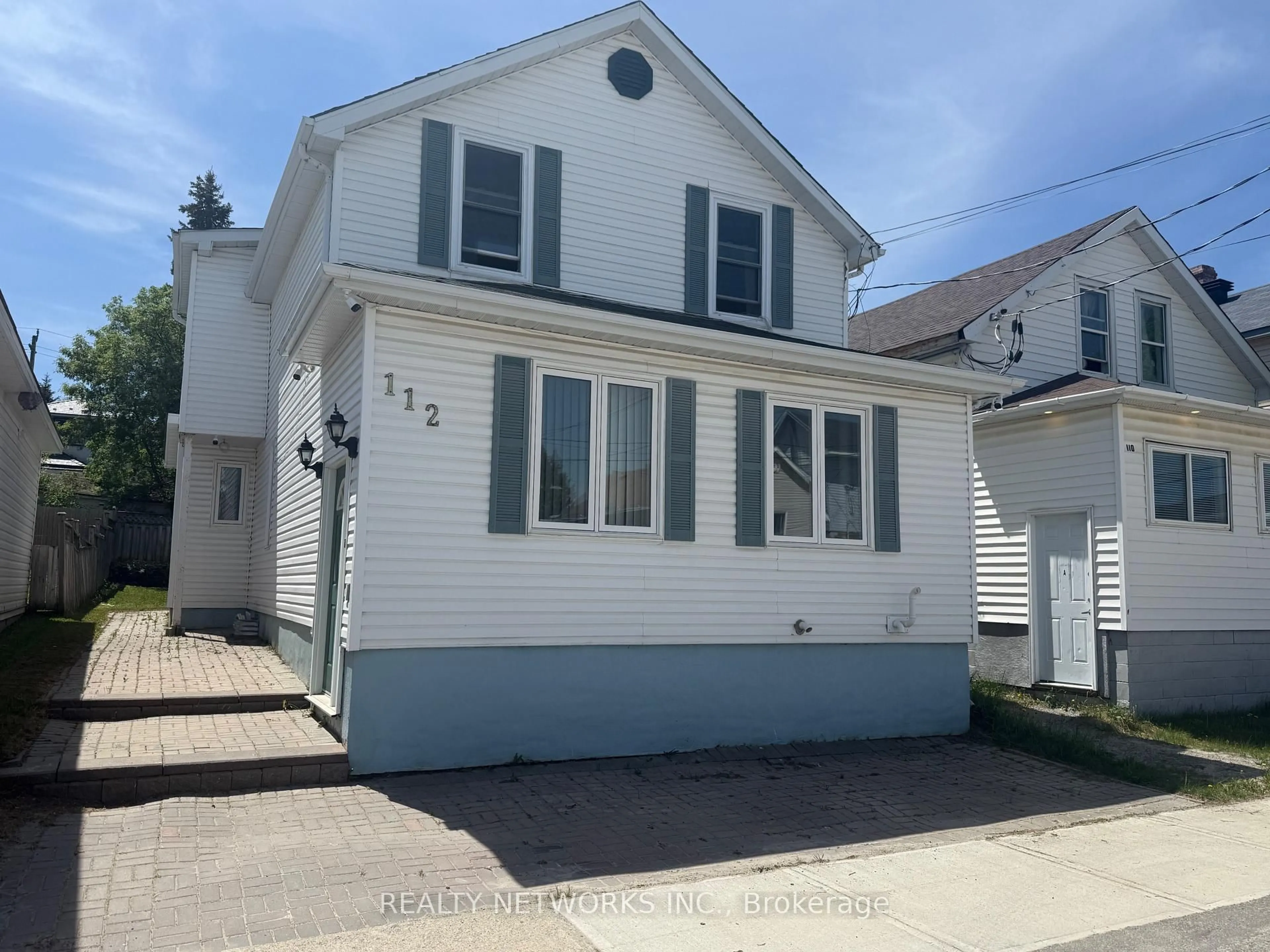 Home with vinyl exterior material, street for 112 Dwyer Ave, Timmins Ontario P0M 1G0