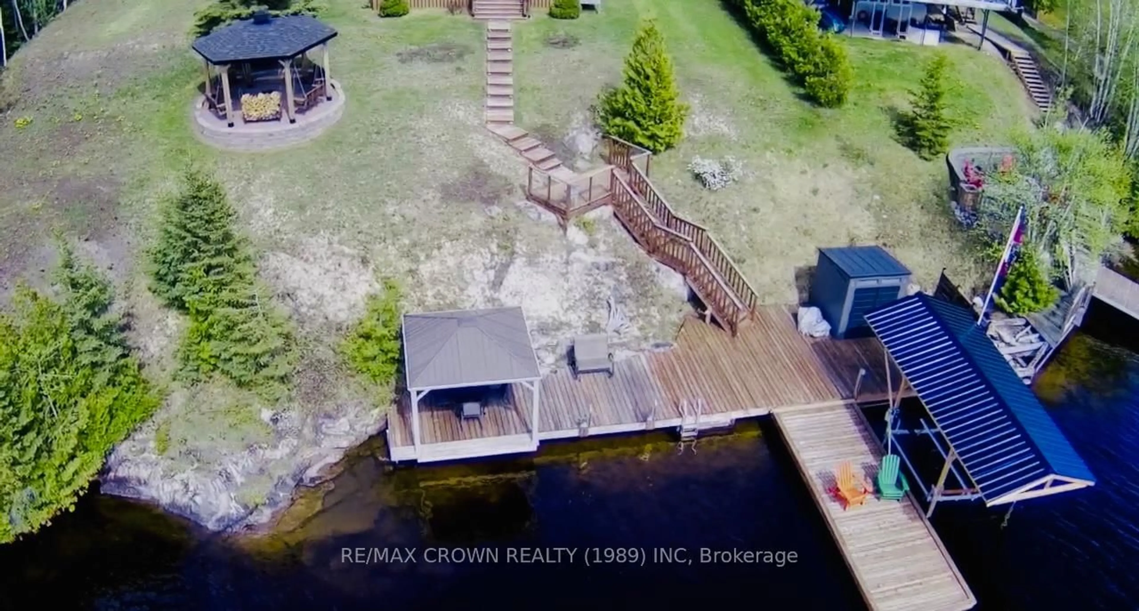 A pic from outside/outdoor area/front of a property/back of a property/a pic from drone, water/lake/river/ocean view for 31 Lefebvre Peninsula, Moonbeam Rd, Kapuskasing Ontario P0L 1V0