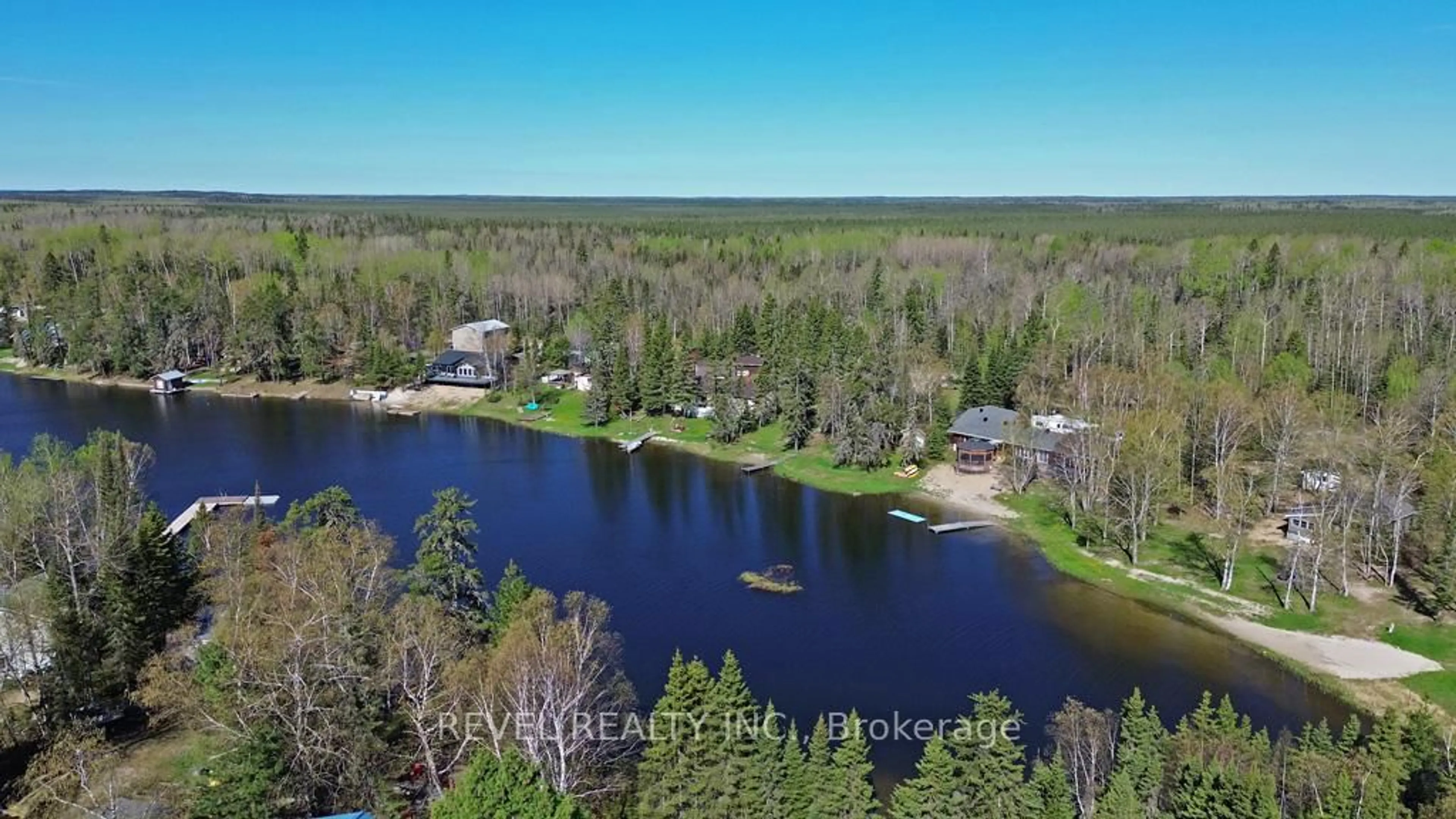 A pic from outside/outdoor area/front of a property/back of a property/a pic from drone, water/lake/river/ocean view for 124 Sunset Bay Rd, Iroquois Falls Ontario P0K 1G0