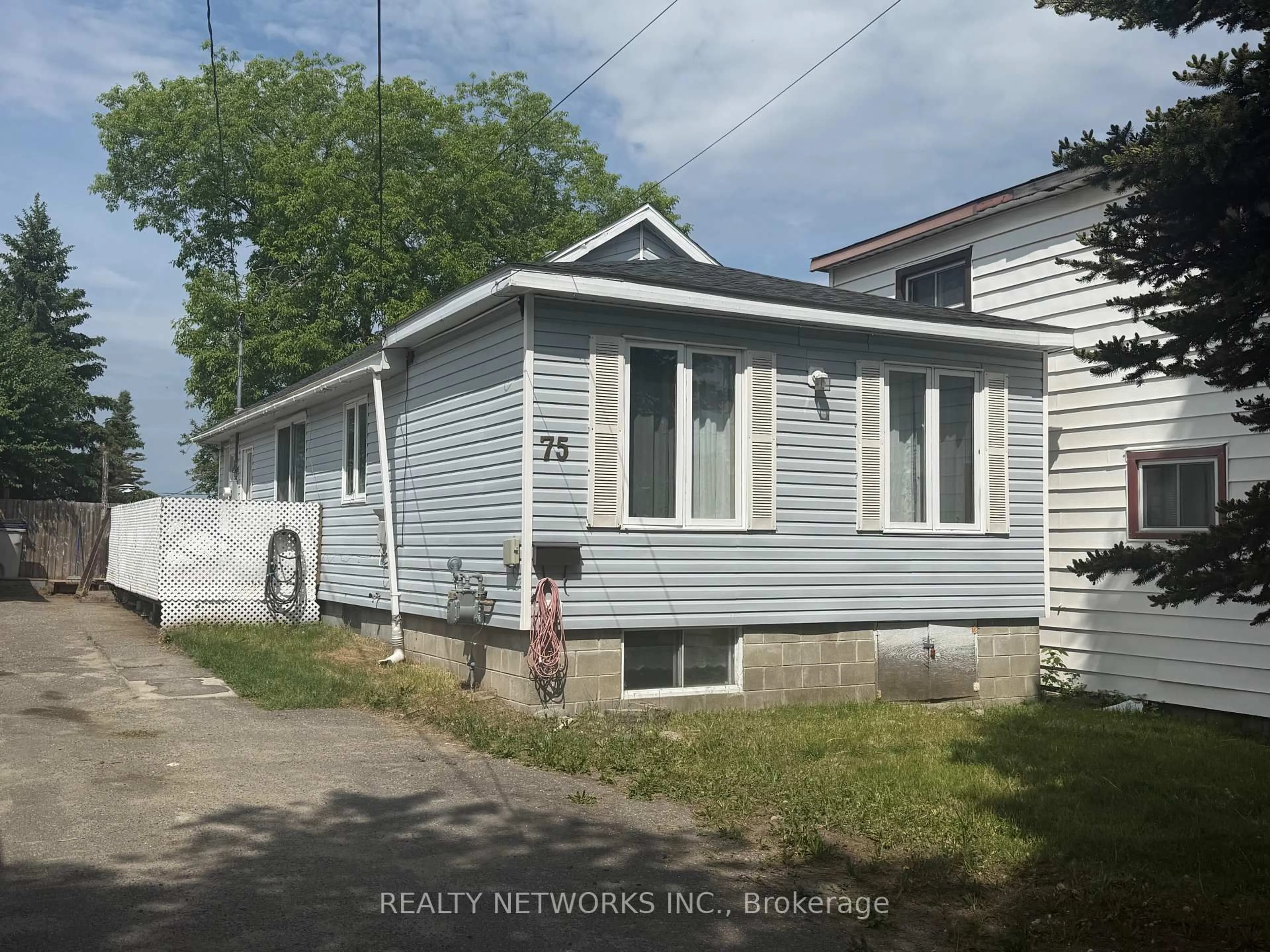 Home with vinyl exterior material, street for 75 Maple St, Timmins Ontario P4N 6B5