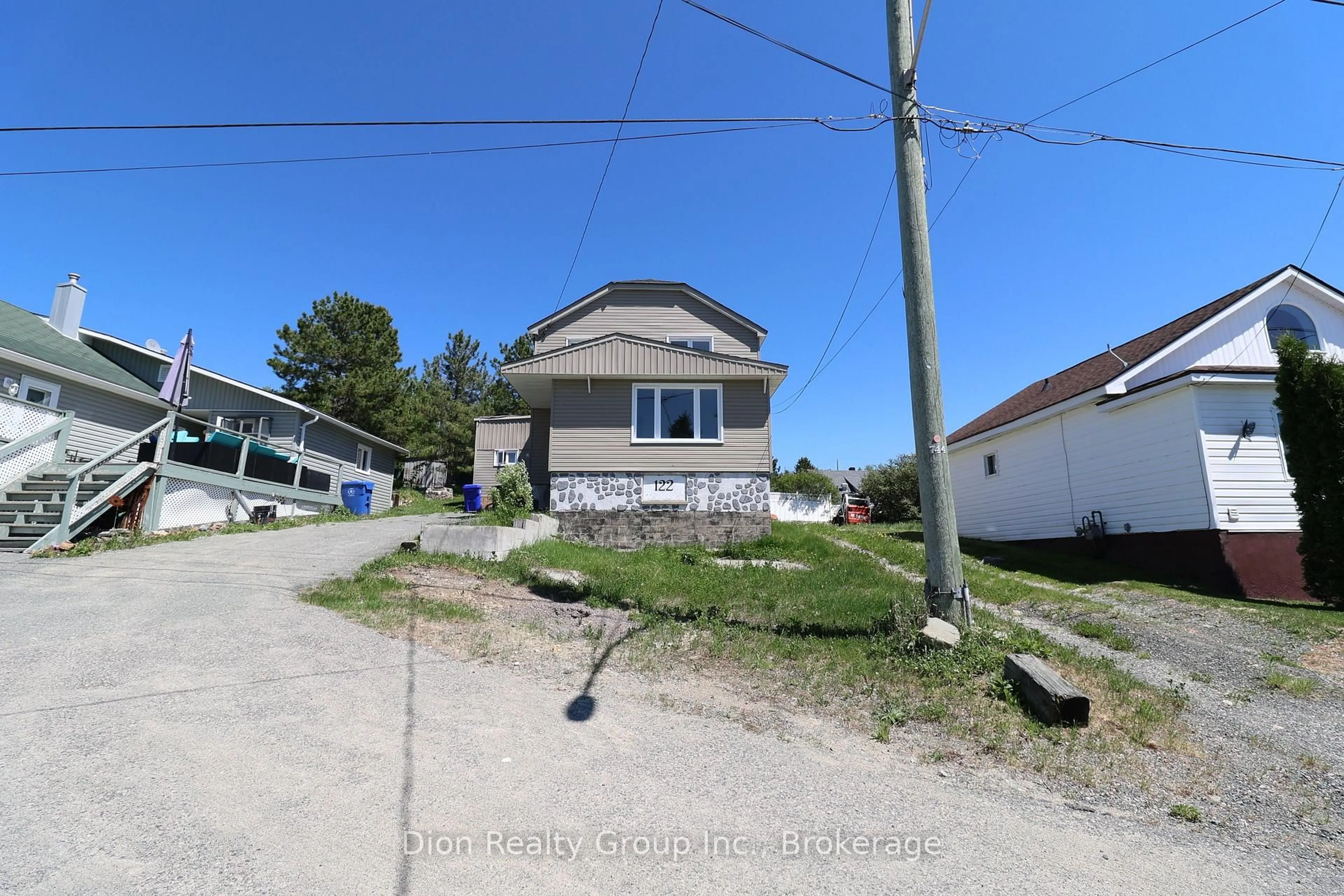 A pic from outside/outdoor area/front of a property/back of a property/a pic from drone, street for 122 Carter Ave, Kirkland Lake Ontario P2N 1Z7