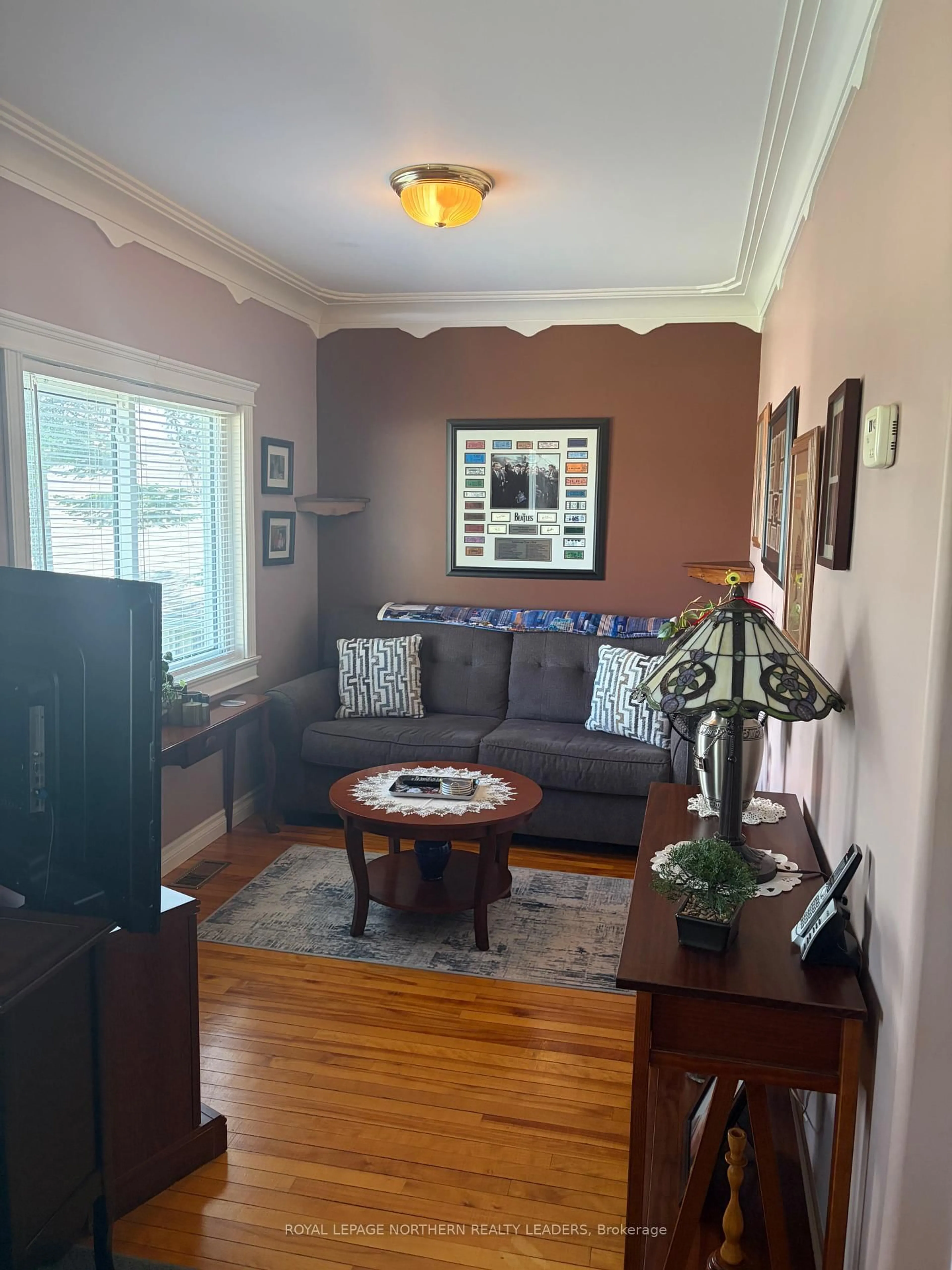 Living room with furniture, wood/laminate floor for 327 Belleview St, Timmins Ontario P4N 5B3