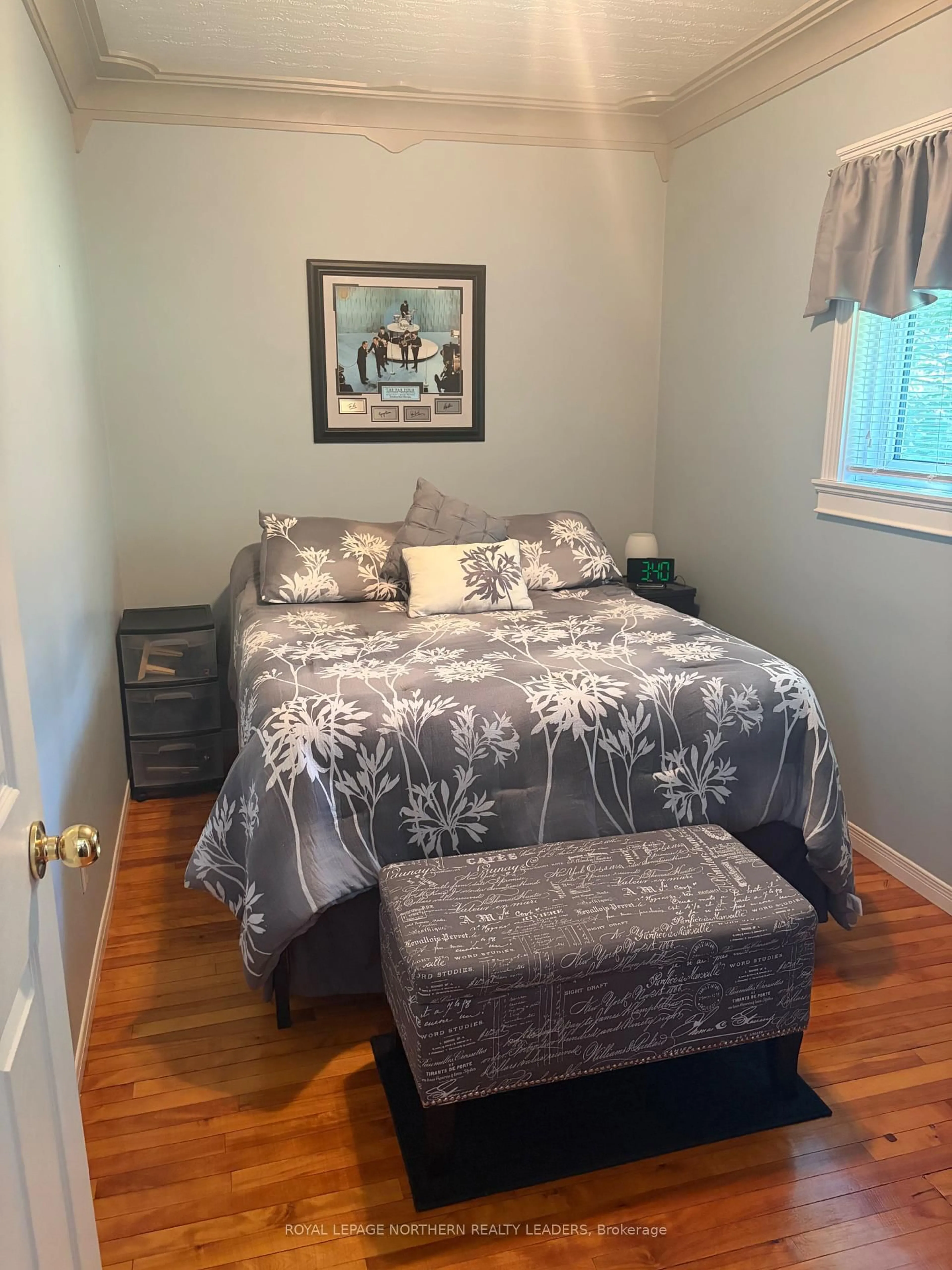 Bedroom with bed, wood/laminate floor for 327 Belleview St, Timmins Ontario P4N 5B3