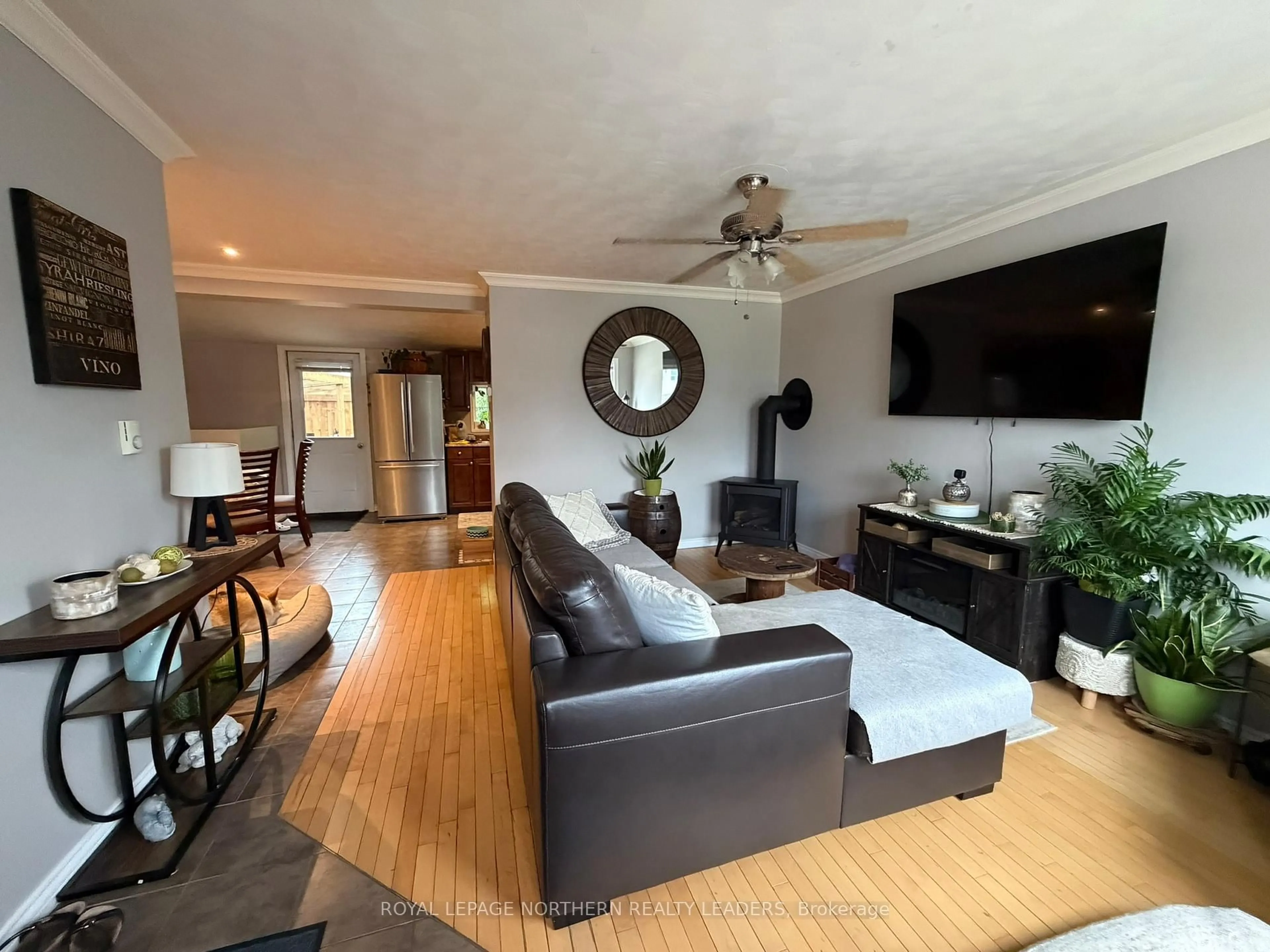 Living room with furniture, wood/laminate floor for 296 Ann Ave, Timmins Ontario P4N 4T9