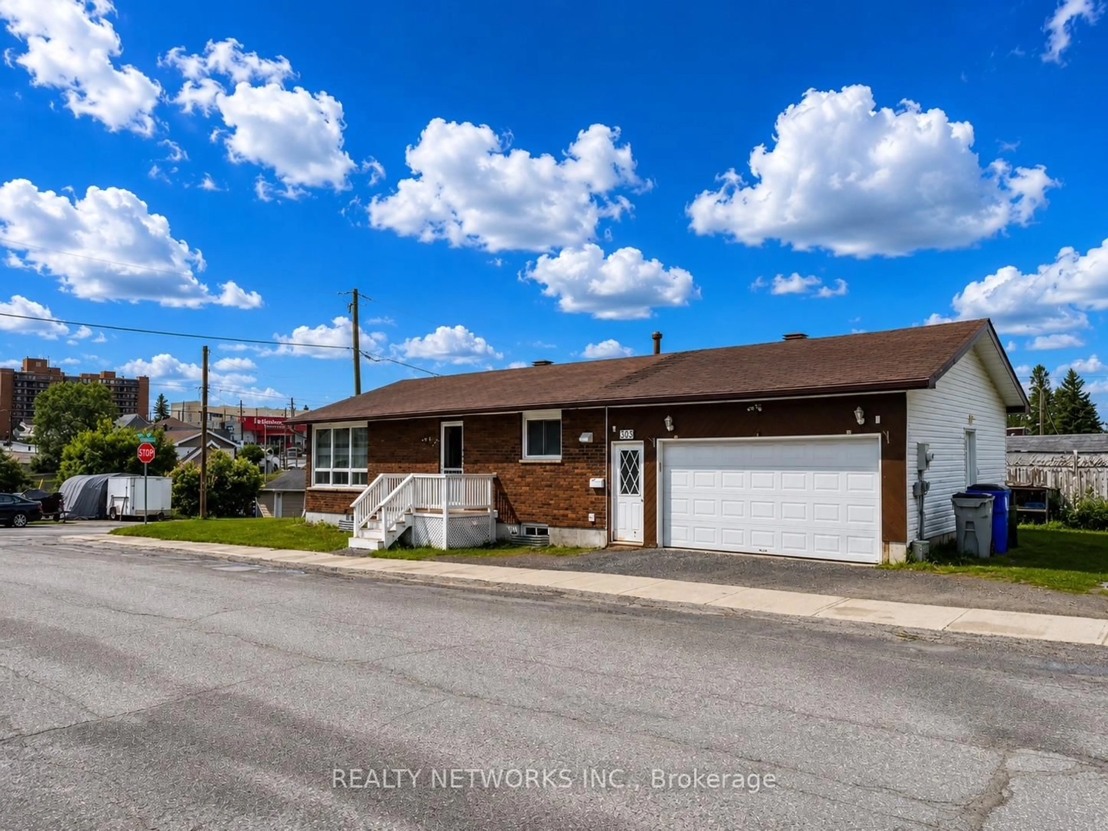 A pic from outside/outdoor area/front of a property/back of a property/a pic from drone, street for 303 Poplar Ave, Timmins Ontario P4N 4S2