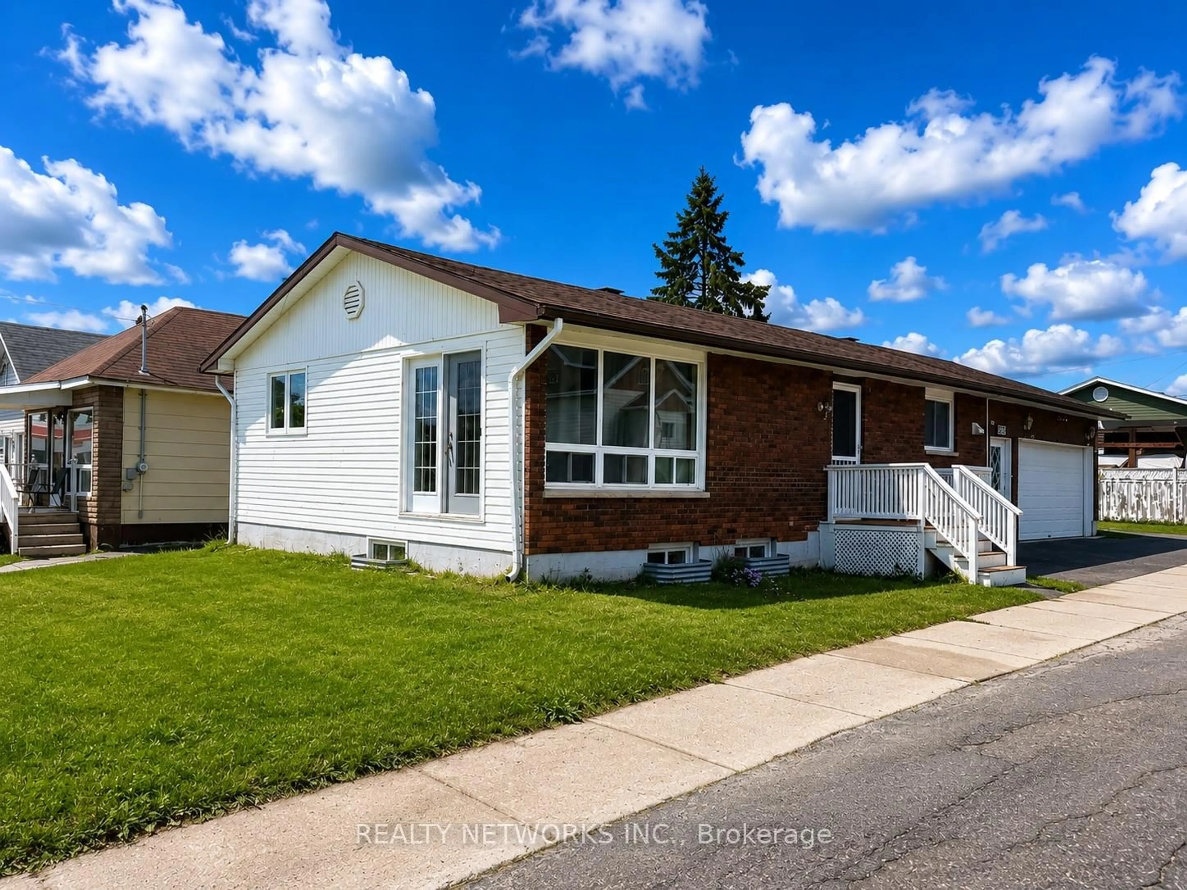 Home with vinyl exterior material, street for 303 Poplar Ave, Timmins Ontario P4N 4S2