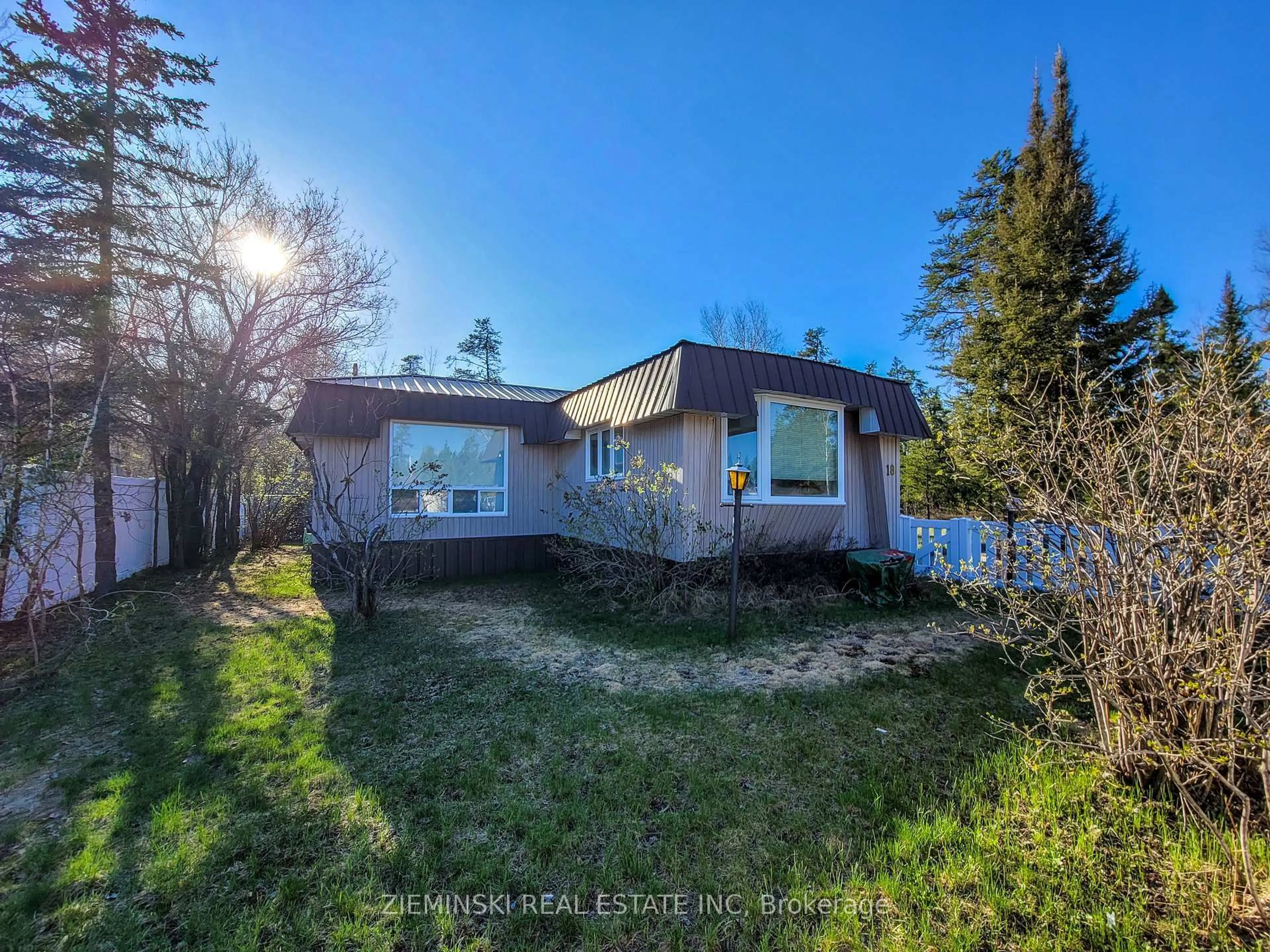 A pic from outside/outdoor area/front of a property/back of a property/a pic from drone, unknown for 18-8885 Hwy 11 Highway, Iroquois Falls Ontario P0K 1G0