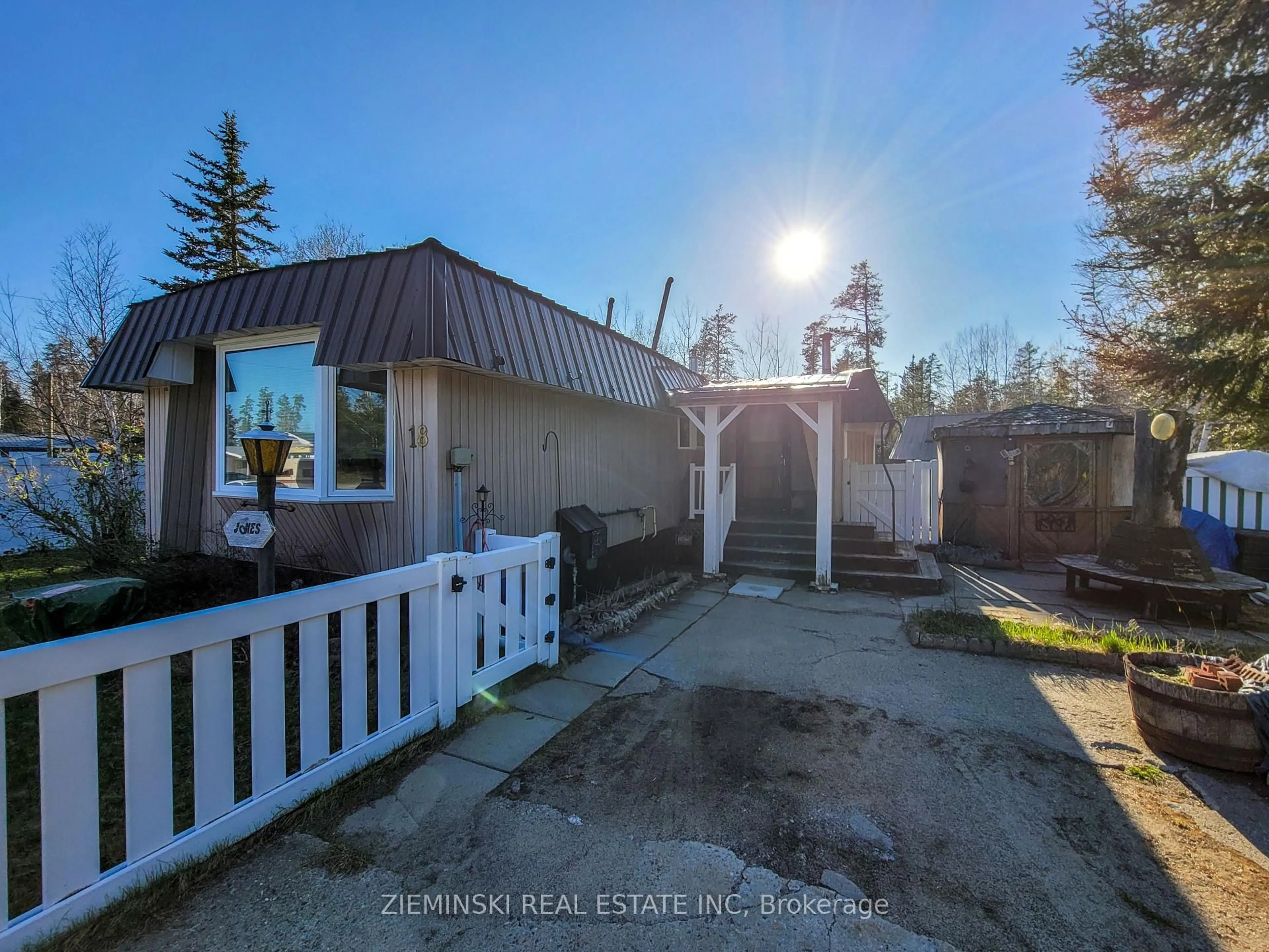 A pic from outside/outdoor area/front of a property/back of a property/a pic from drone, street for 18-8885 Hwy 11 Highway, Iroquois Falls Ontario P0K 1G0