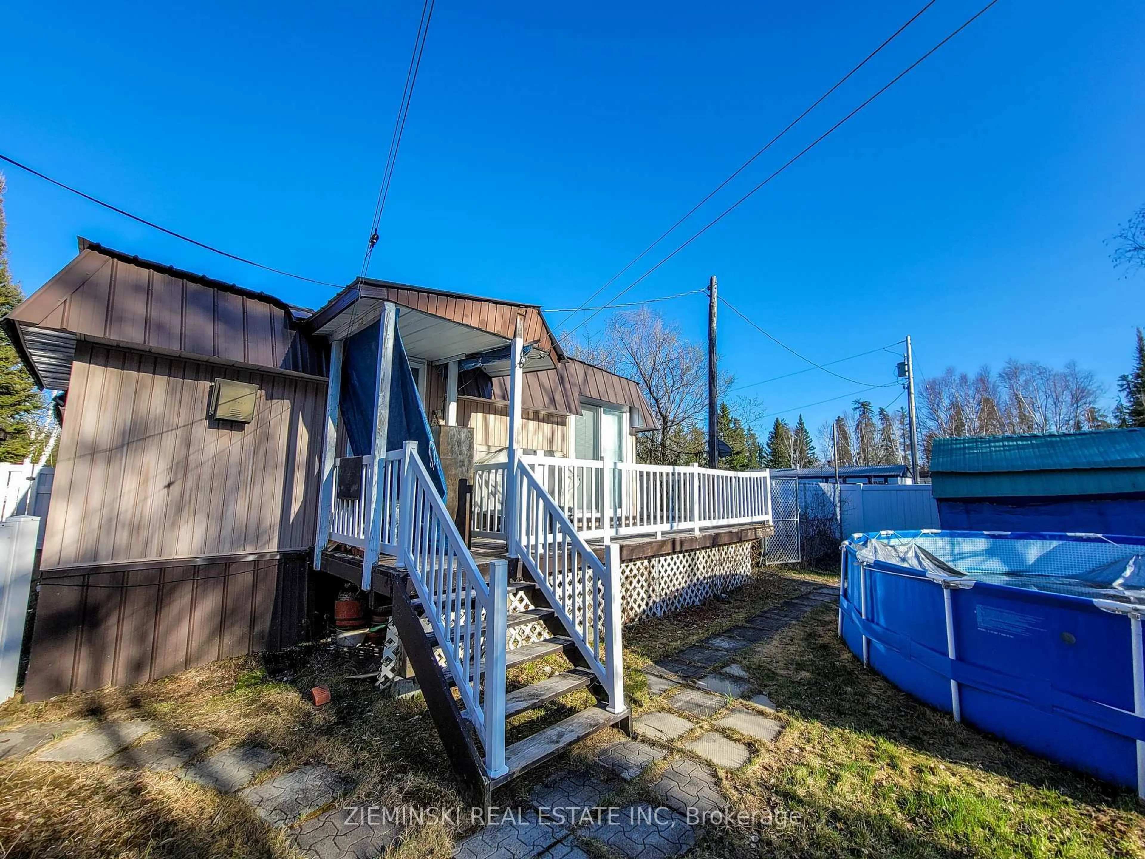 A pic from outside/outdoor area/front of a property/back of a property/a pic from drone, street for 18-8885 Hwy 11 Highway, Iroquois Falls Ontario P0K 1G0
