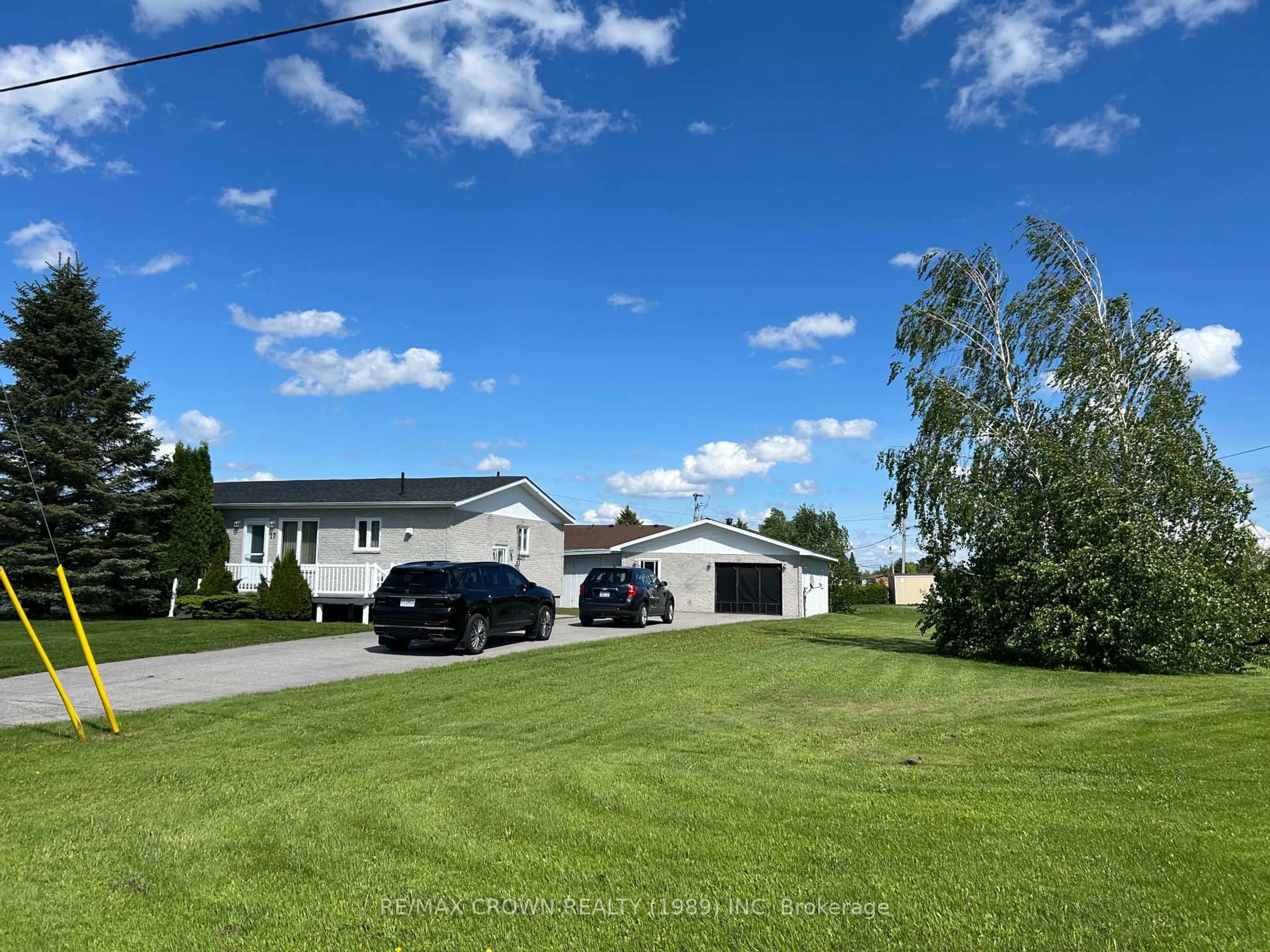 A pic from outside/outdoor area/front of a property/back of a property/a pic from drone, street for 17 Tremblay, Fauquier Ave, Kapuskasing Ontario P0L 1G0