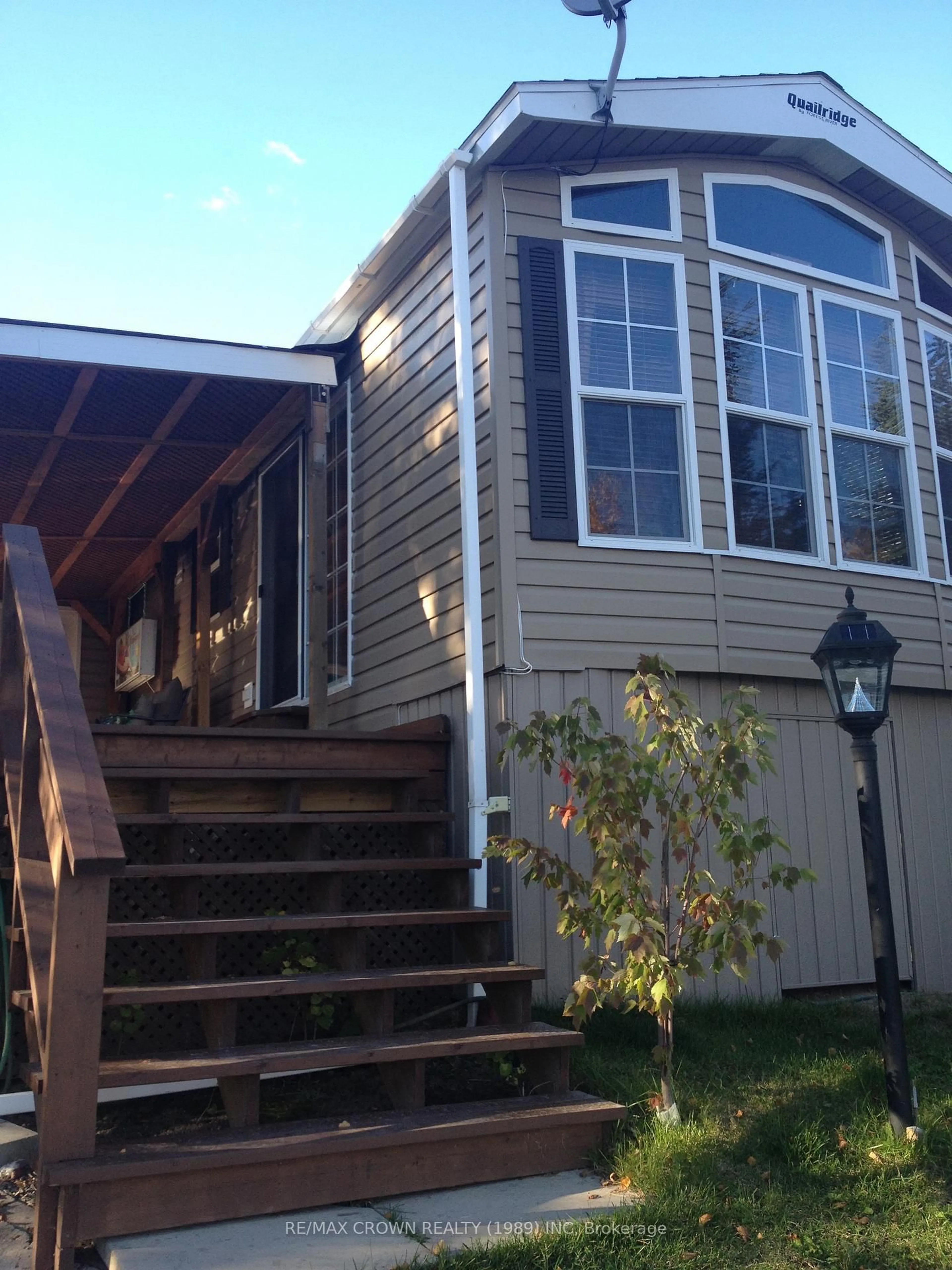 Home with vinyl exterior material, street for 219 Lefebvre Peninsula, Remi Lake, Moonbeam Rd, Kapuskasing Ontario P0L 1V0