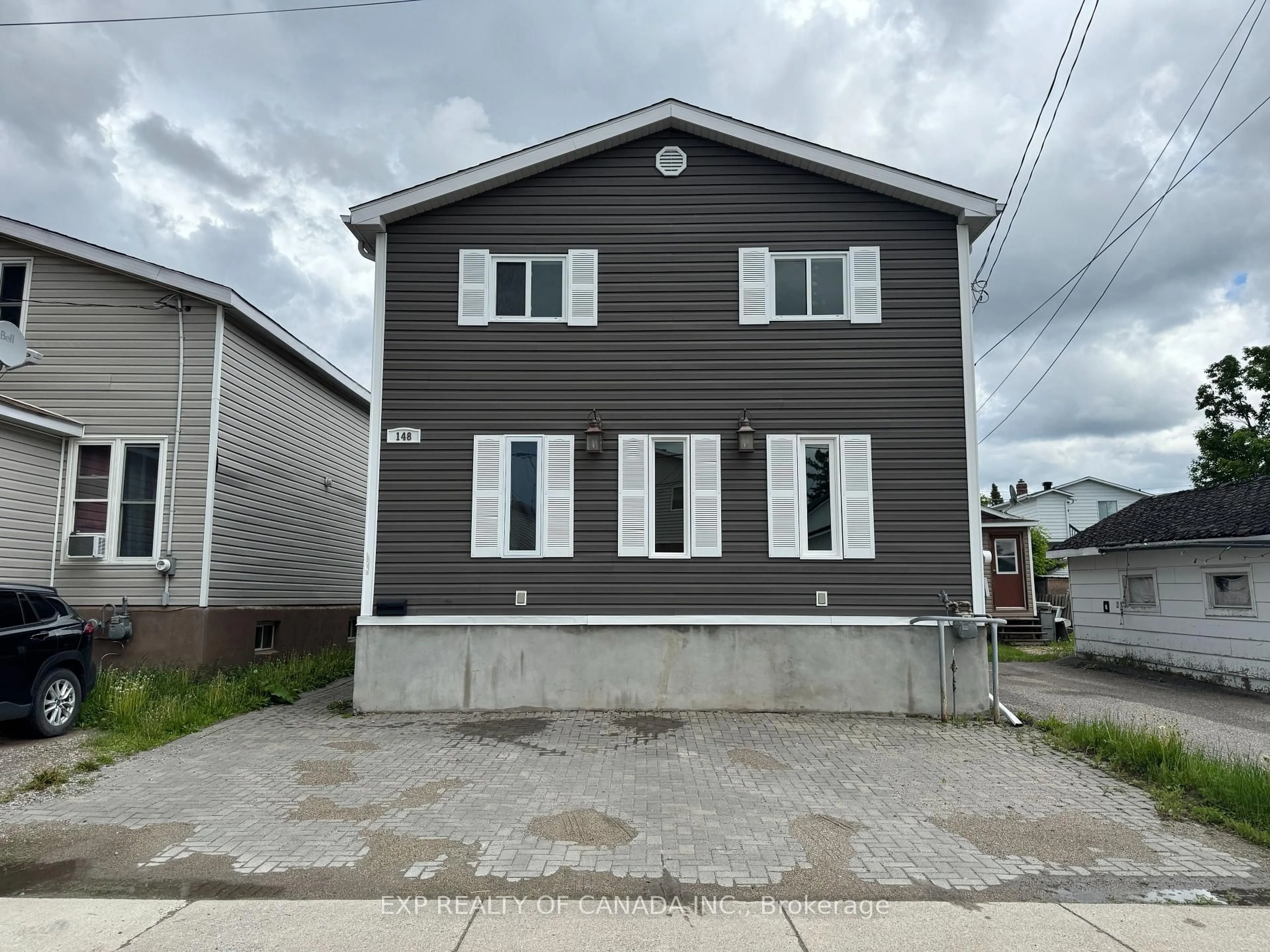 Home with vinyl exterior material, street for 148 Elm St, Timmins Ontario P4N 6A7