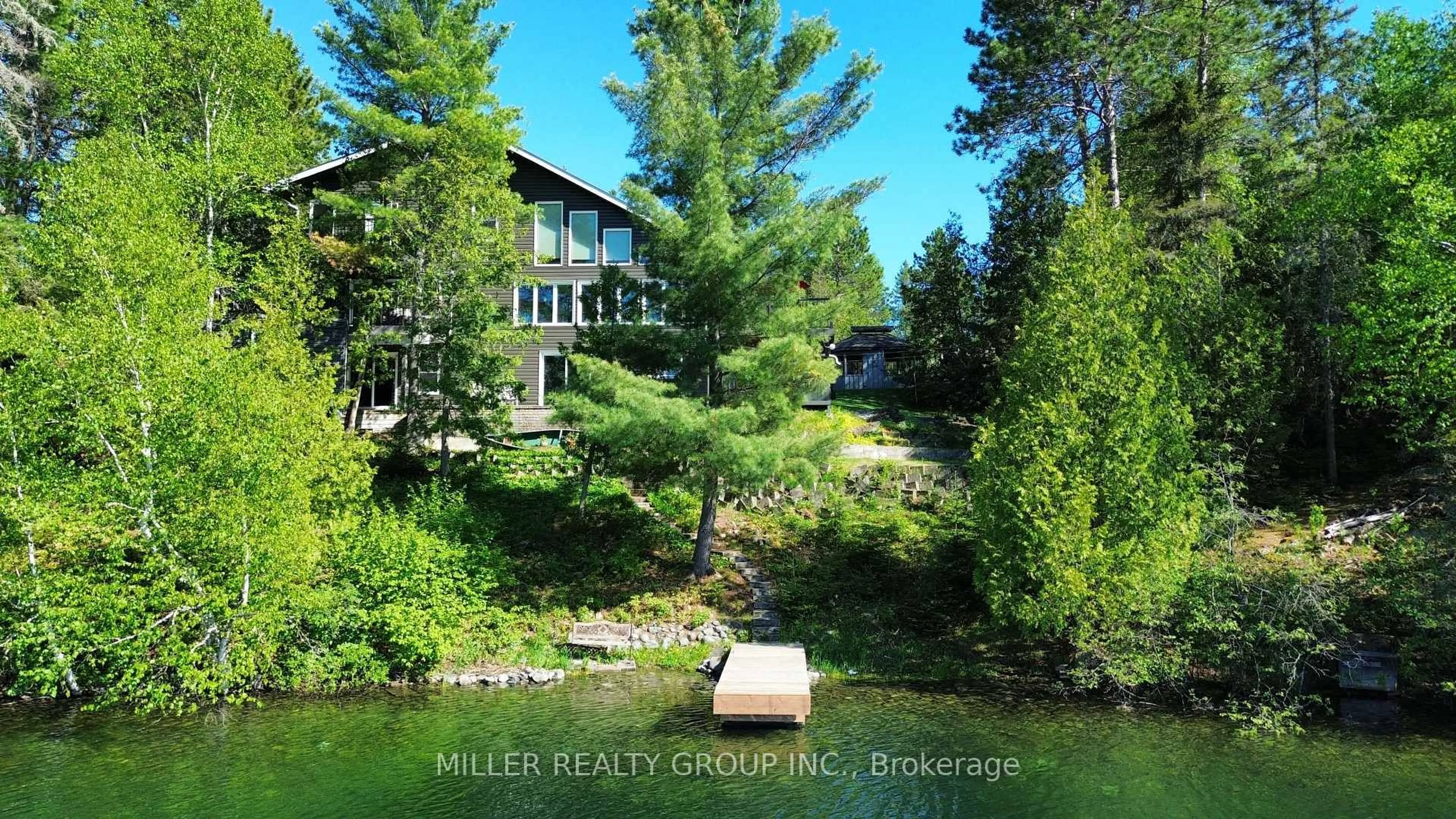 A pic from outside/outdoor area/front of a property/back of a property/a pic from drone, water/lake/river/ocean view for 877606 Bass Lake Rd, Timiskaming Ontario P0J 1C0