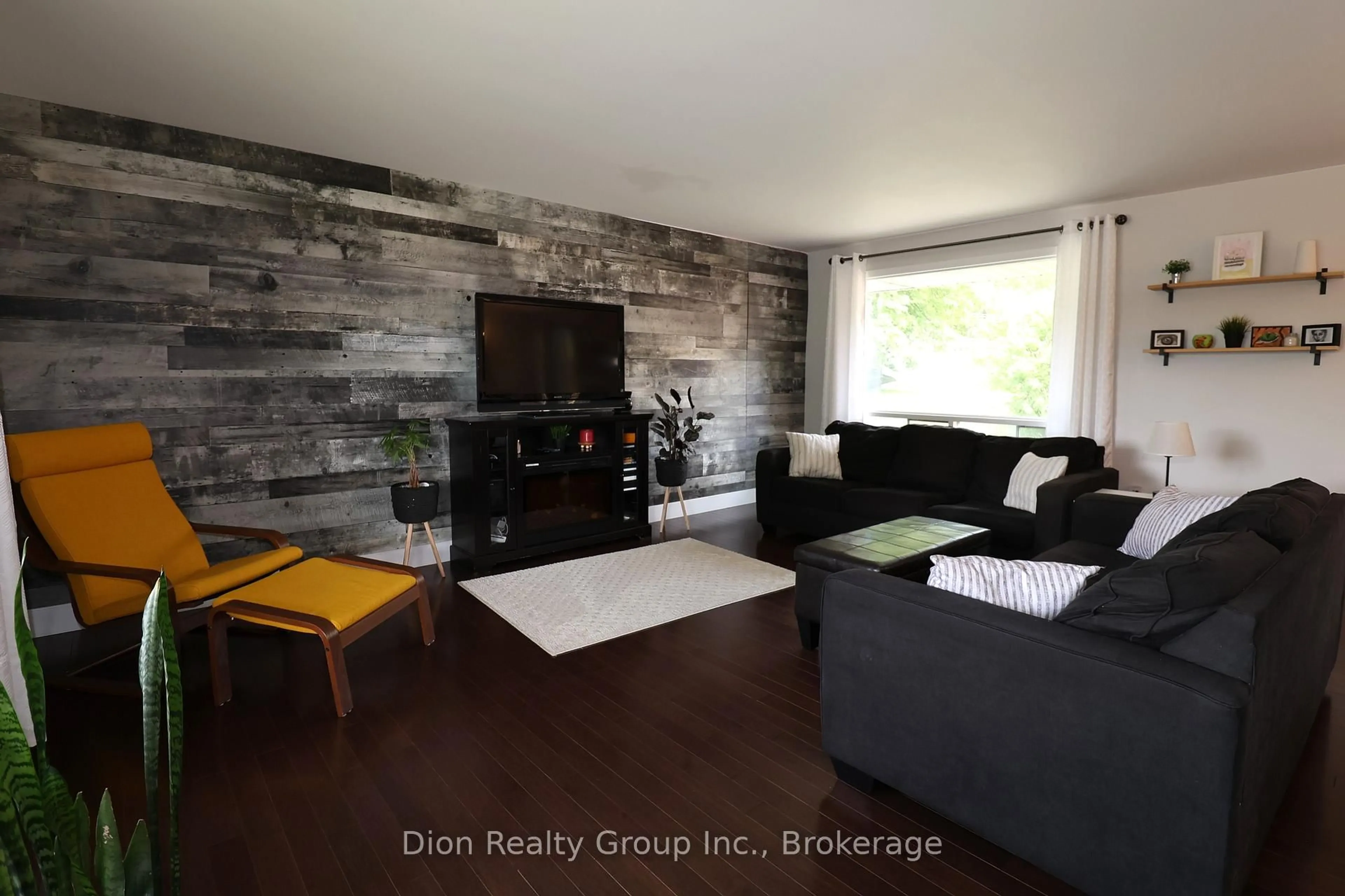 Living room with furniture, wood/laminate floor for 30 Macpherson Ave, Kirkland Lake Ontario P2N 1B8