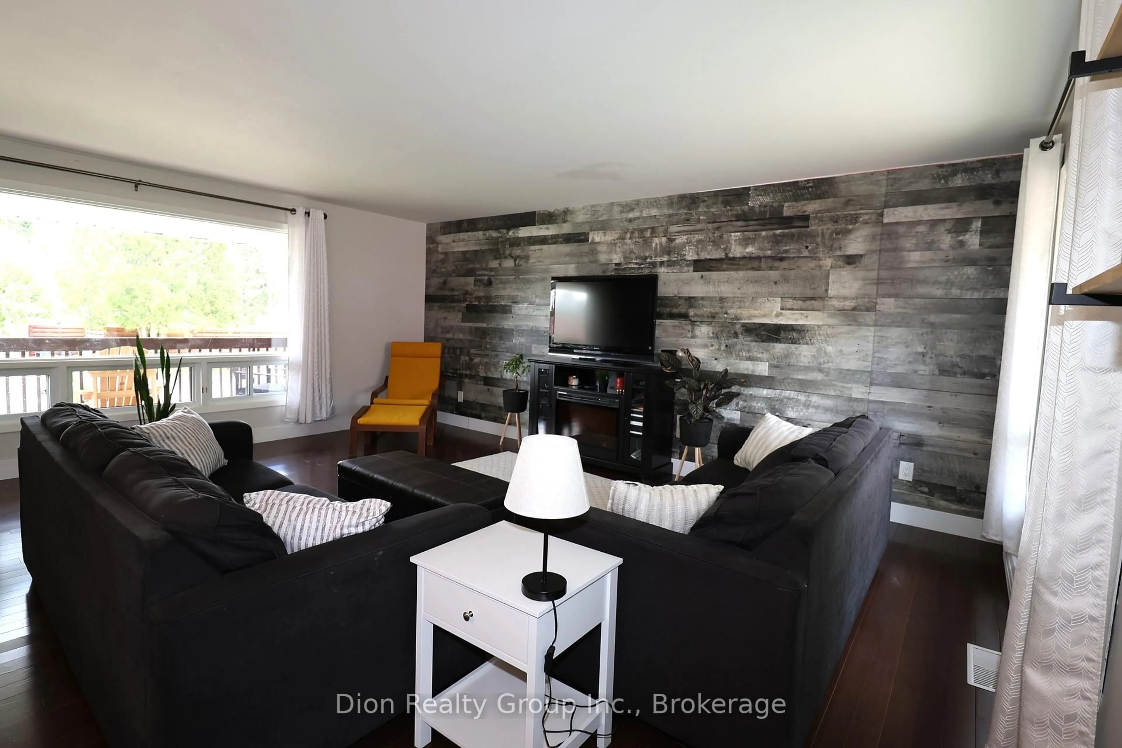 Living room with furniture, wood/laminate floor for 30 Macpherson Ave, Kirkland Lake Ontario P2N 1B8