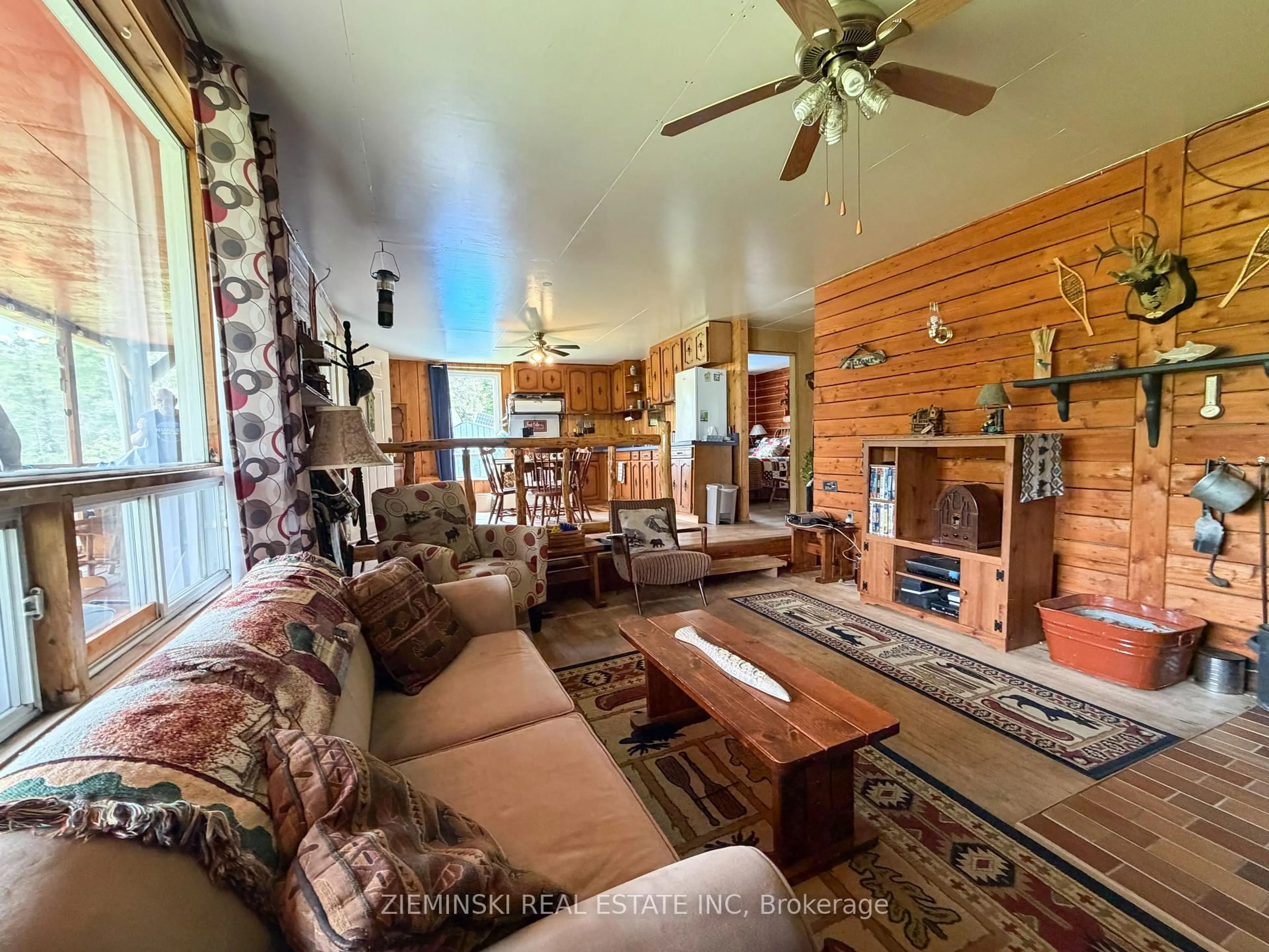 Living room with furniture, wood/laminate floor for 22 Rapids Ave, Cochrane Ontario P0L 1C0