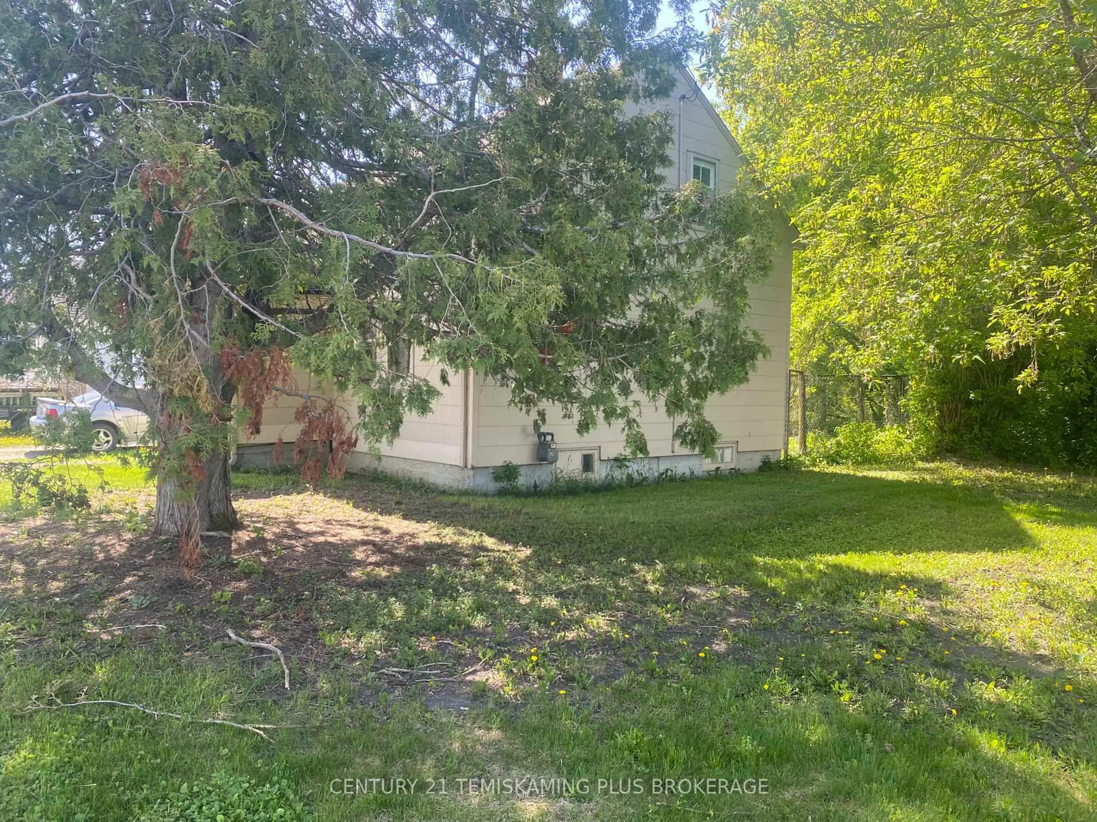 A pic from outside/outdoor area/front of a property/back of a property/a pic from drone, forest/trees view for 408 Grills St, Temiskaming Shores Ontario P0J 1P0