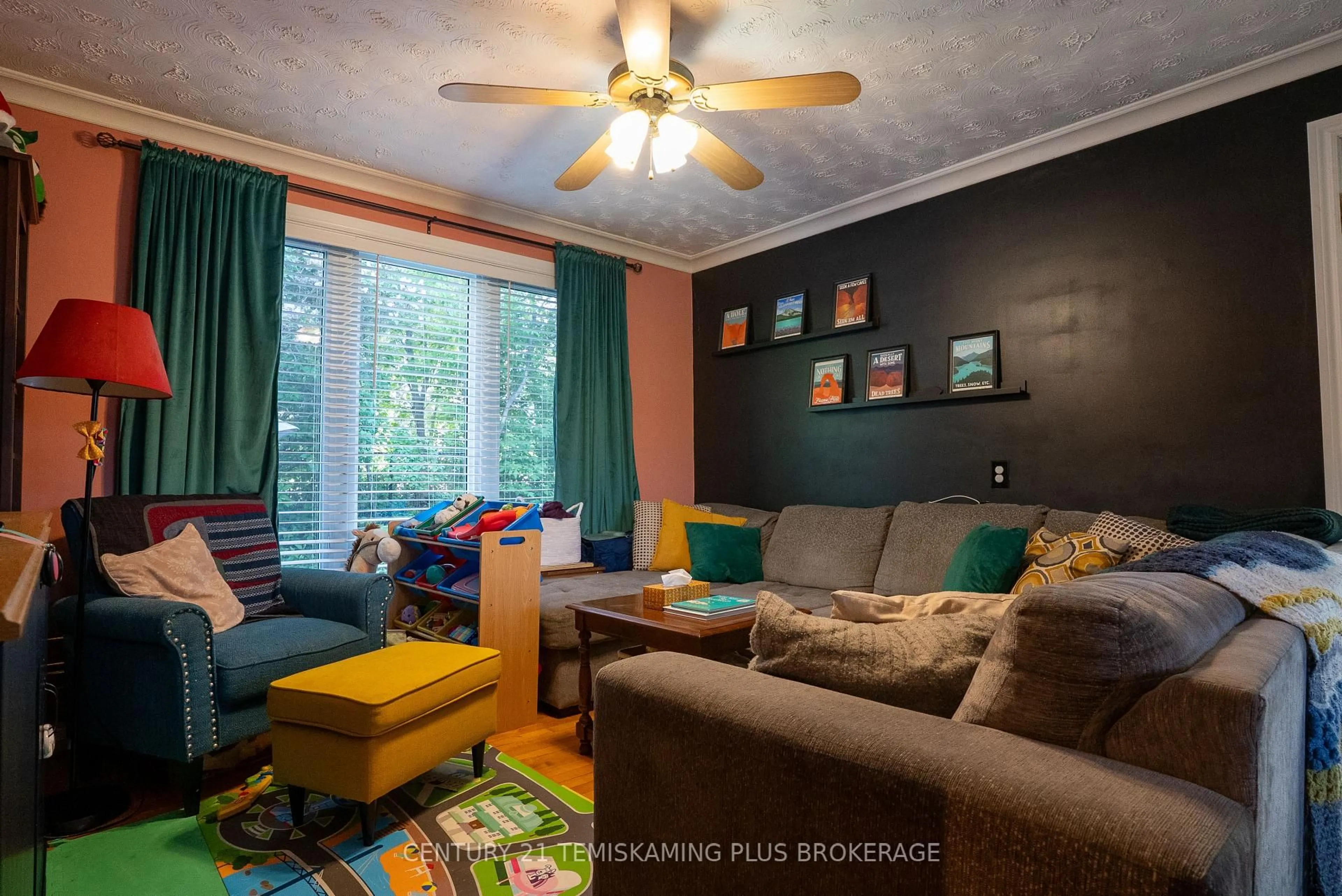 Living room with furniture, wood/laminate floor for 381 Meridian Ave, Temiskaming Shores Ontario P0J 1K0