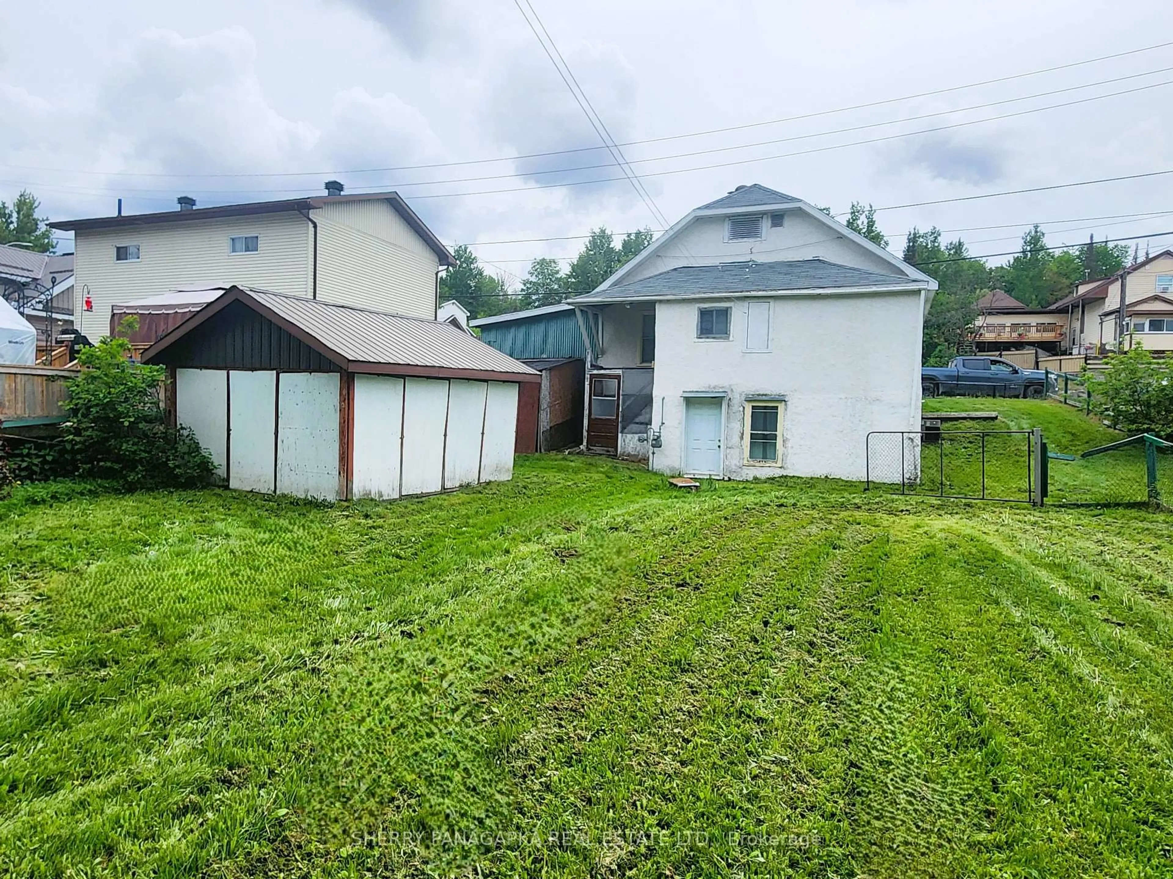 A pic from outside/outdoor area/front of a property/back of a property/a pic from drone, street for 661 Government Rd, Kirkland Lake Ontario P0K 1A0