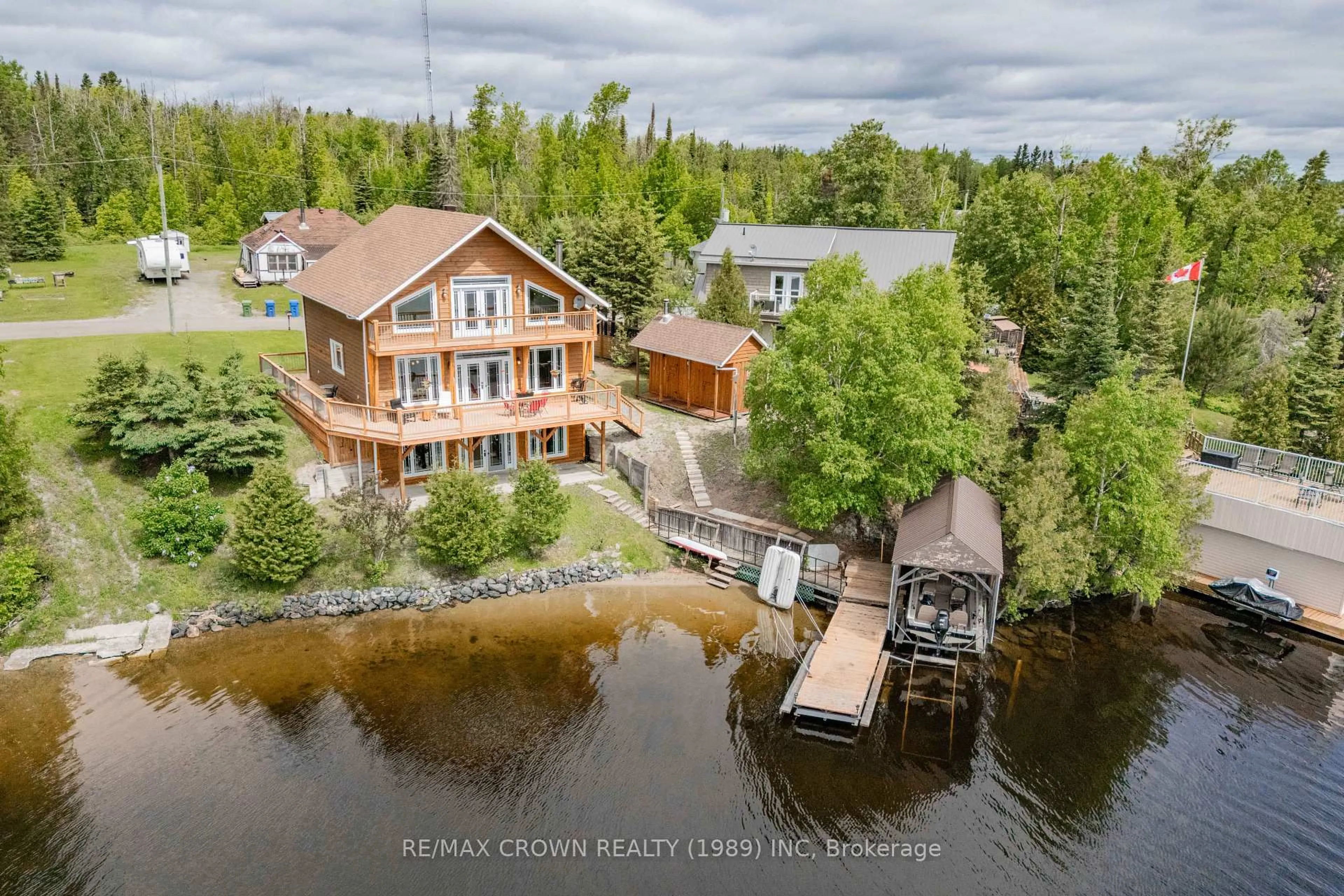A pic from outside/outdoor area/front of a property/back of a property/a pic from drone, water/lake/river/ocean view for 205 Lefebvre Peninsula Rd #Moonbeam, Kapuskasing Ontario P0L 1V0