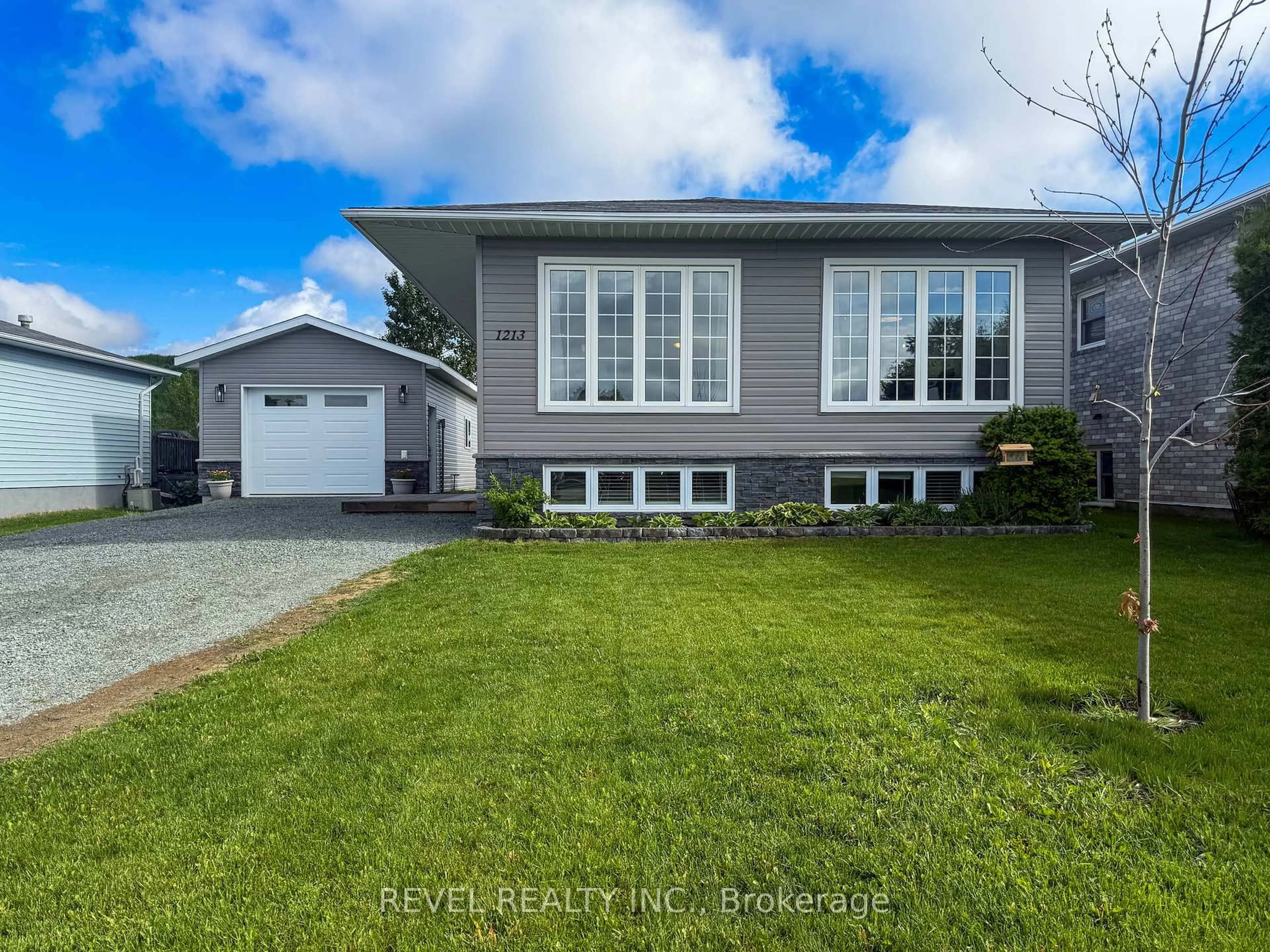 Home with vinyl exterior material, street for 1213 Lozanne Cres, Timmins Ontario P4P 1E7