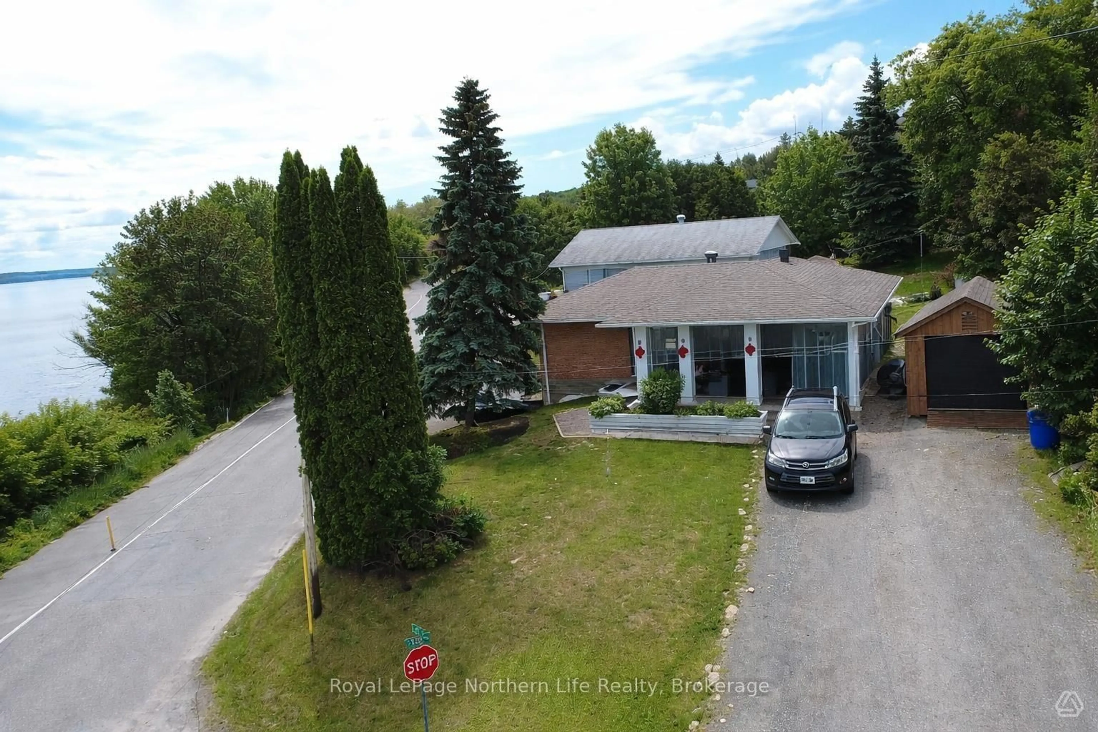 A pic from outside/outdoor area/front of a property/back of a property/a pic from drone, unknown for 224 ELLIOTT St, Temiskaming Shores Ontario P0J 1K0