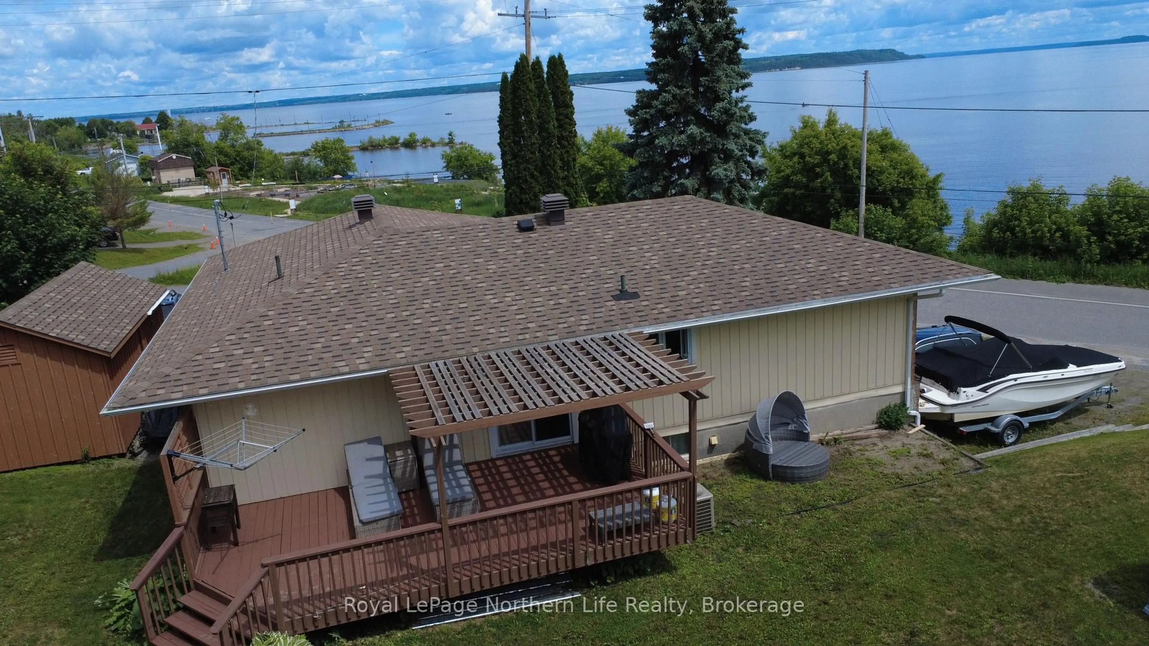 A pic from outside/outdoor area/front of a property/back of a property/a pic from drone, water/lake/river/ocean view for 224 ELLIOTT St, Temiskaming Shores Ontario P0J 1K0