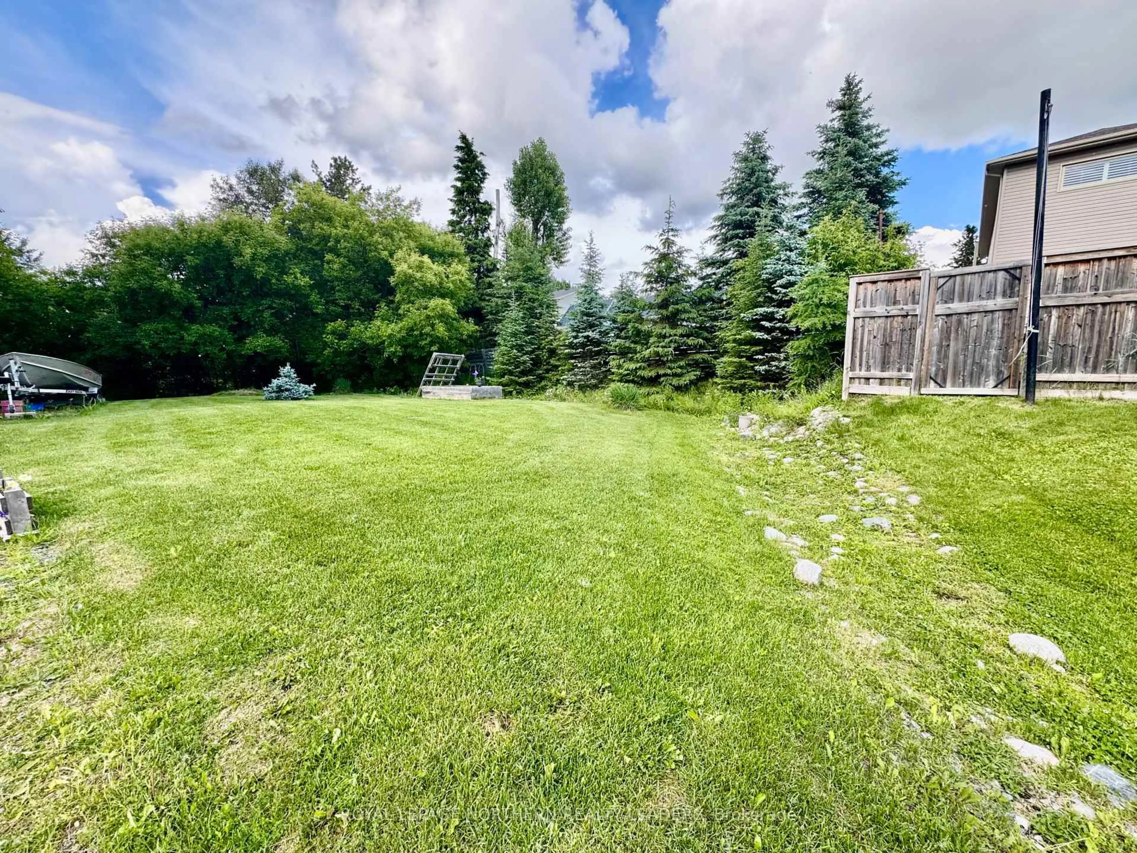 A pic from outside/outdoor area/front of a property/back of a property/a pic from drone, forest/trees view for 524 Cedar St, Timmins Ontario P4N 6K3