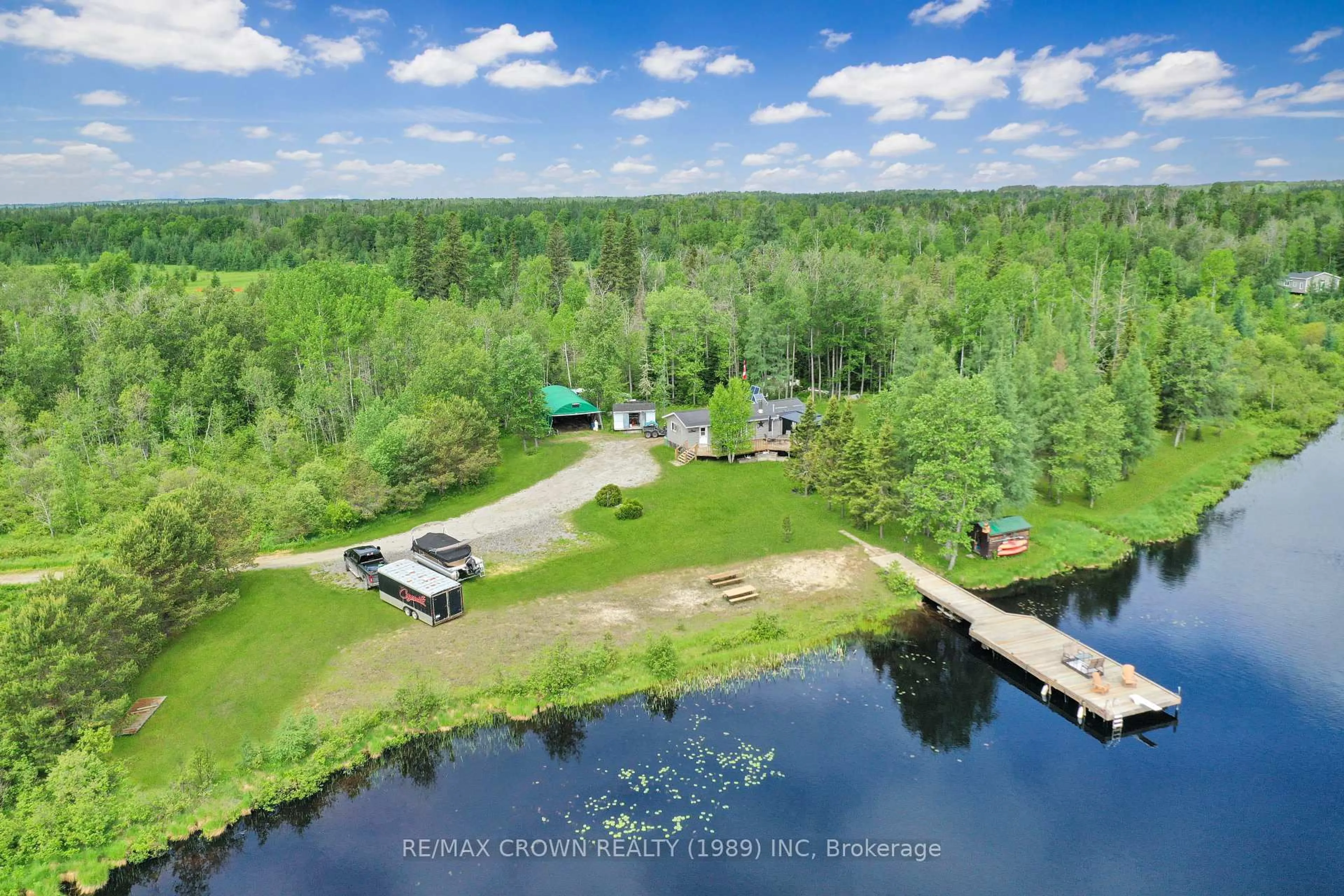 A pic from outside/outdoor area/front of a property/back of a property/a pic from drone, water/lake/river/ocean view for 11 Lac Brochet Rd #Moonbeam, Kapuskasing Ontario P0L 1V0