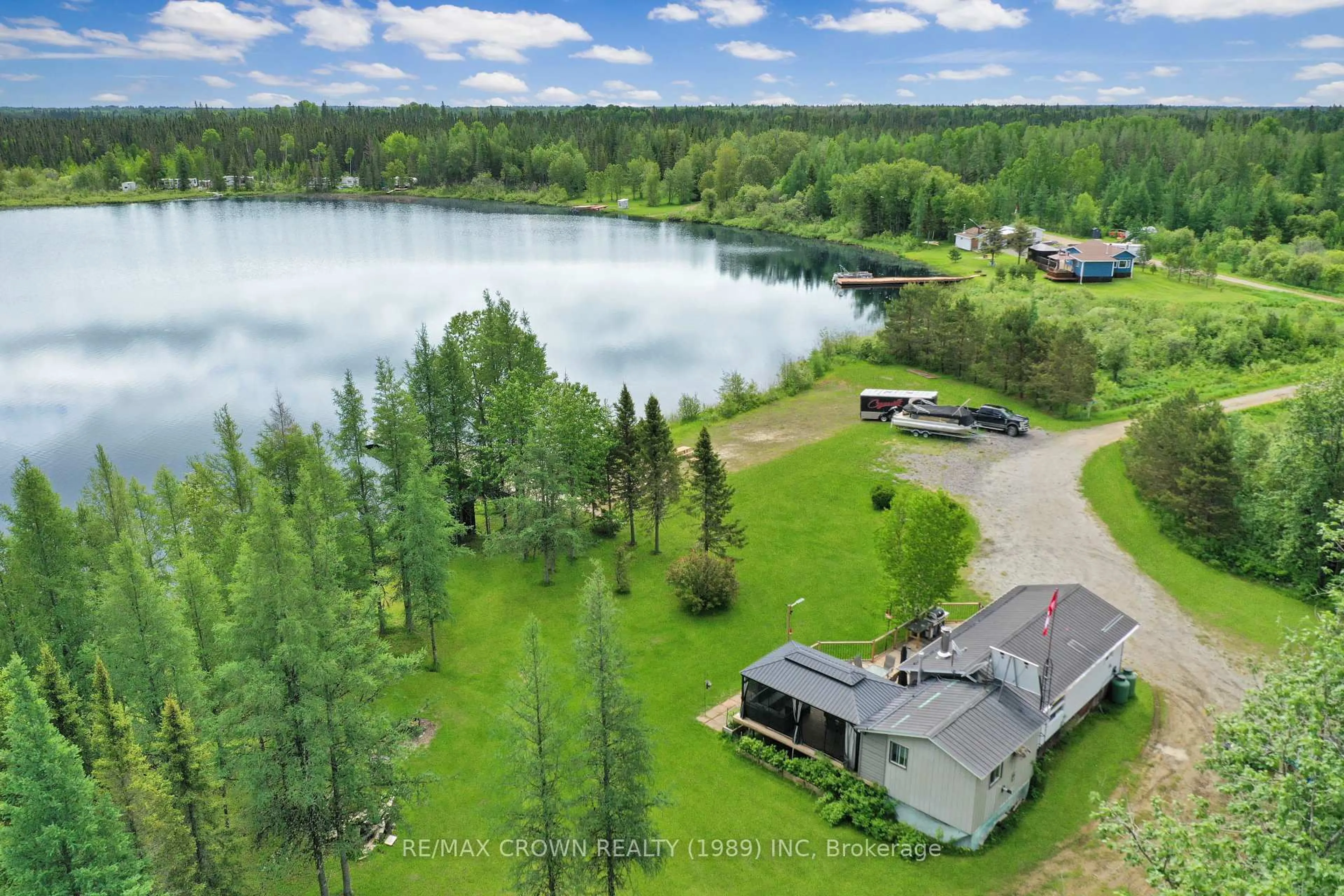 A pic from outside/outdoor area/front of a property/back of a property/a pic from drone, water/lake/river/ocean view for 11 Lac Brochet Rd #Moonbeam, Kapuskasing Ontario P0L 1V0