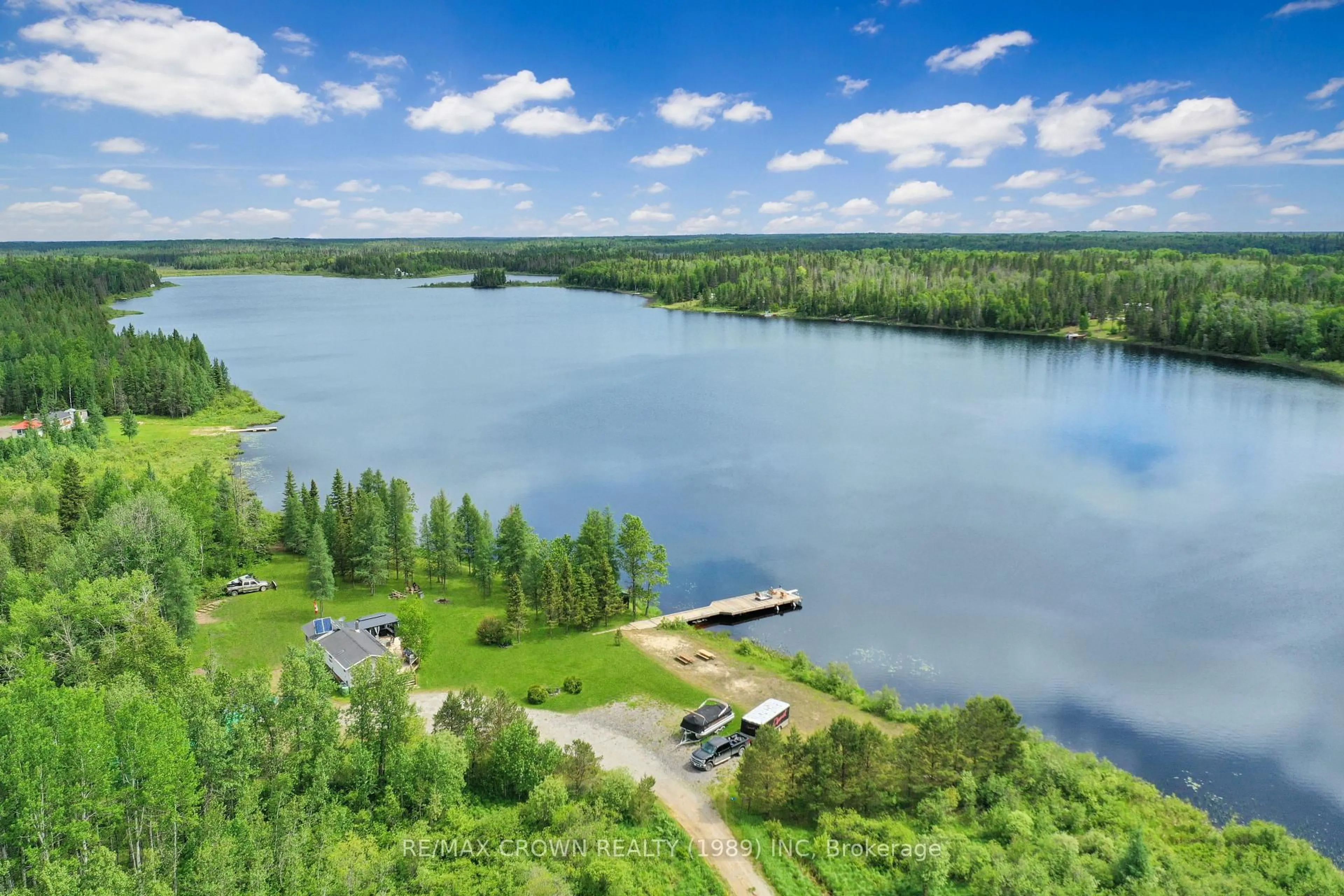 A pic from outside/outdoor area/front of a property/back of a property/a pic from drone, water/lake/river/ocean view for 11 Lac Brochet Rd #Moonbeam, Kapuskasing Ontario P0L 1V0