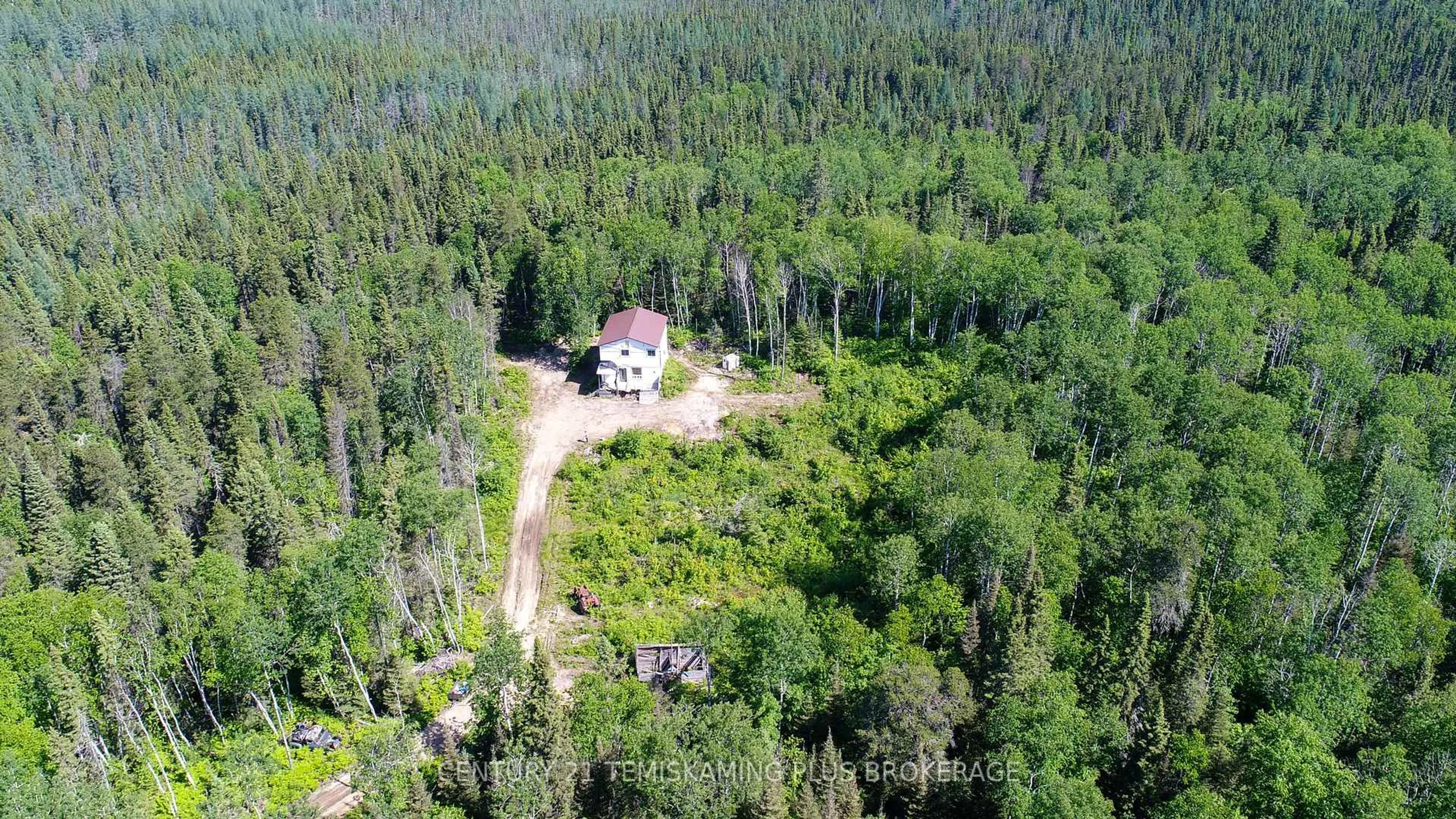 A pic from outside/outdoor area/front of a property/back of a property/a pic from drone, forest/trees view for 9 Jordash Rd, Kirkland Lake Ontario P2N 3M7