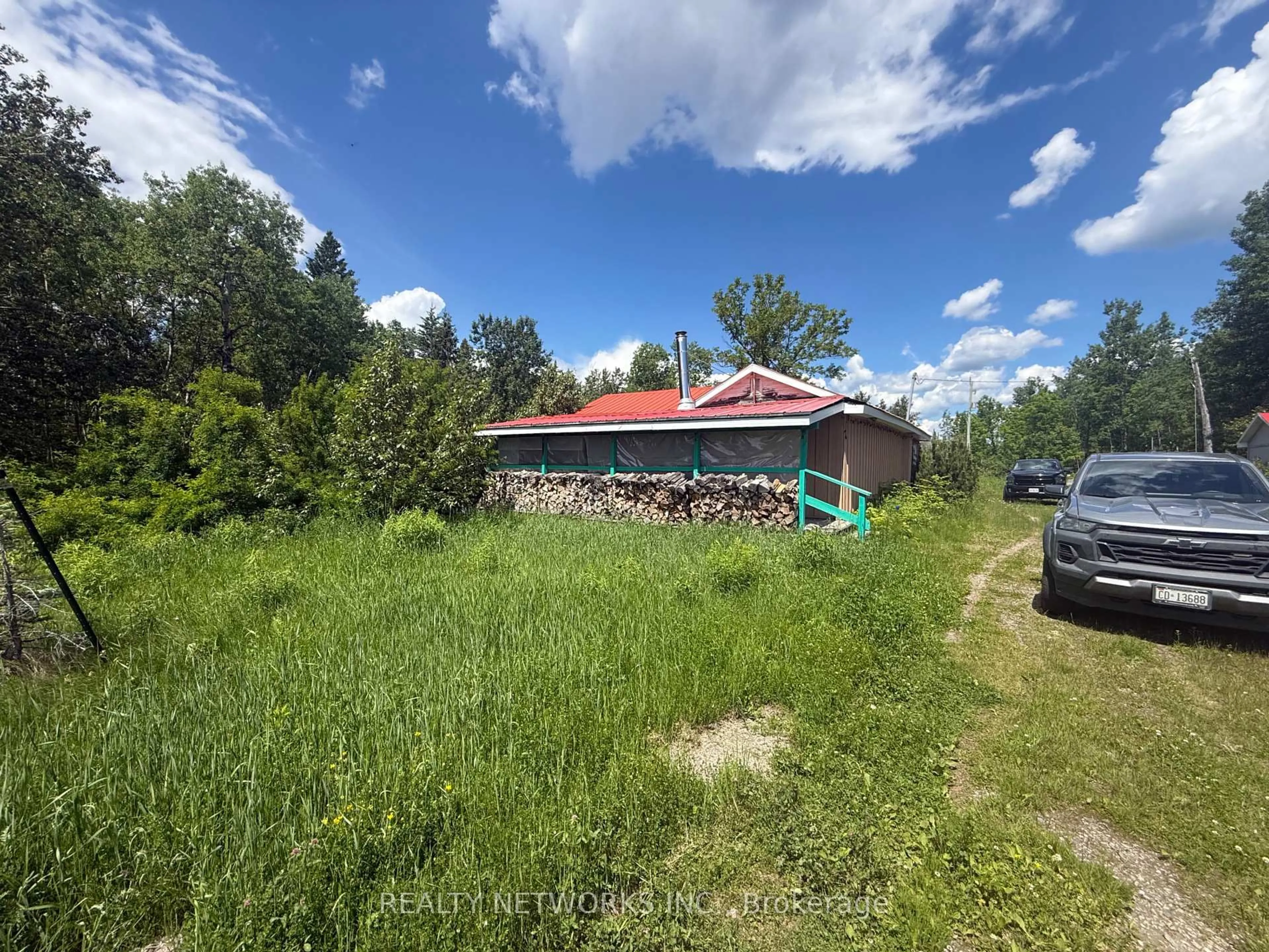 A pic from outside/outdoor area/front of a property/back of a property/a pic from drone, unknown for 1039 Camp Bickell Rd, Iroquois Falls Ontario P0N 1A0